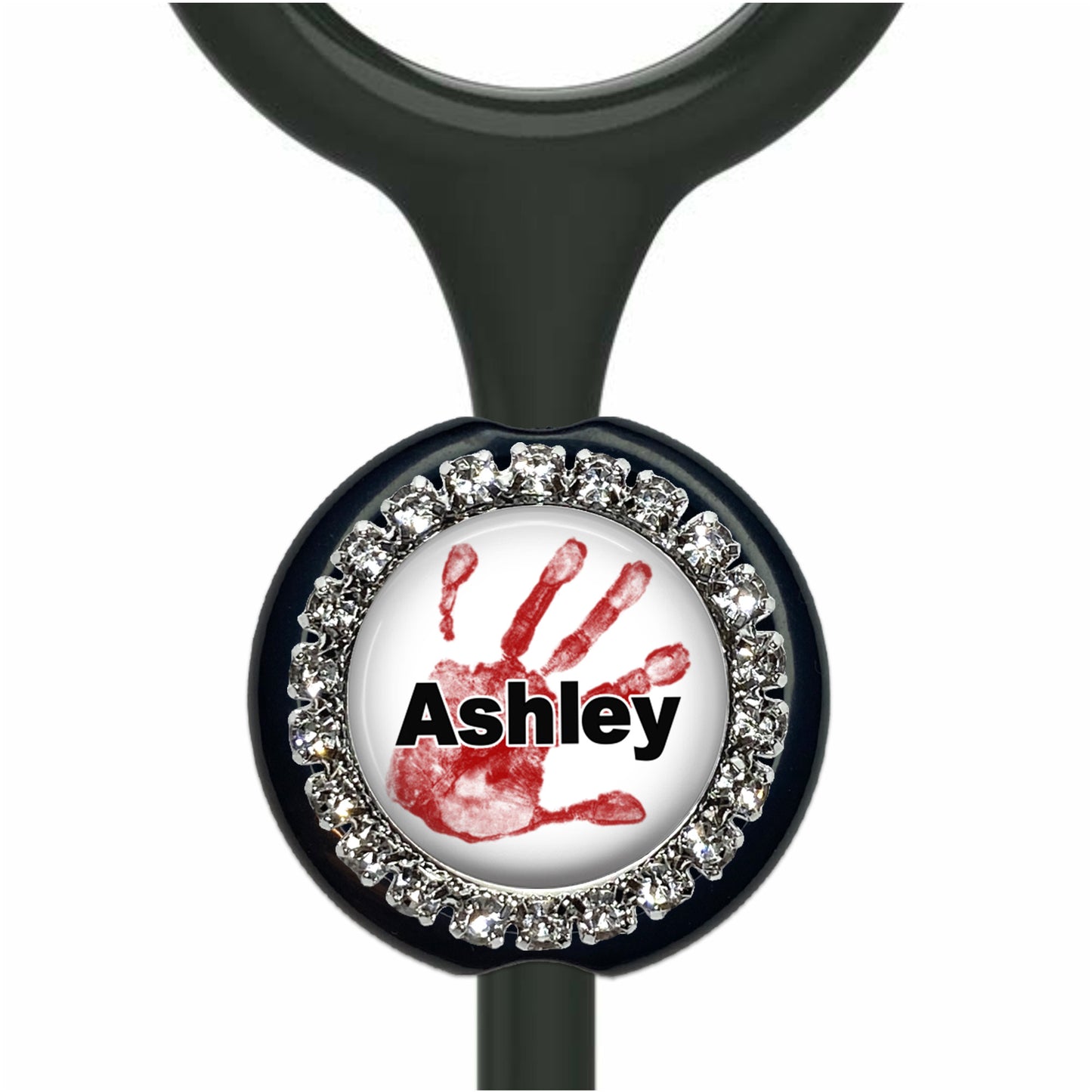 A black stethoscope with a personalized nameplate featuring a red handprint and the name "Ashley" written in black.