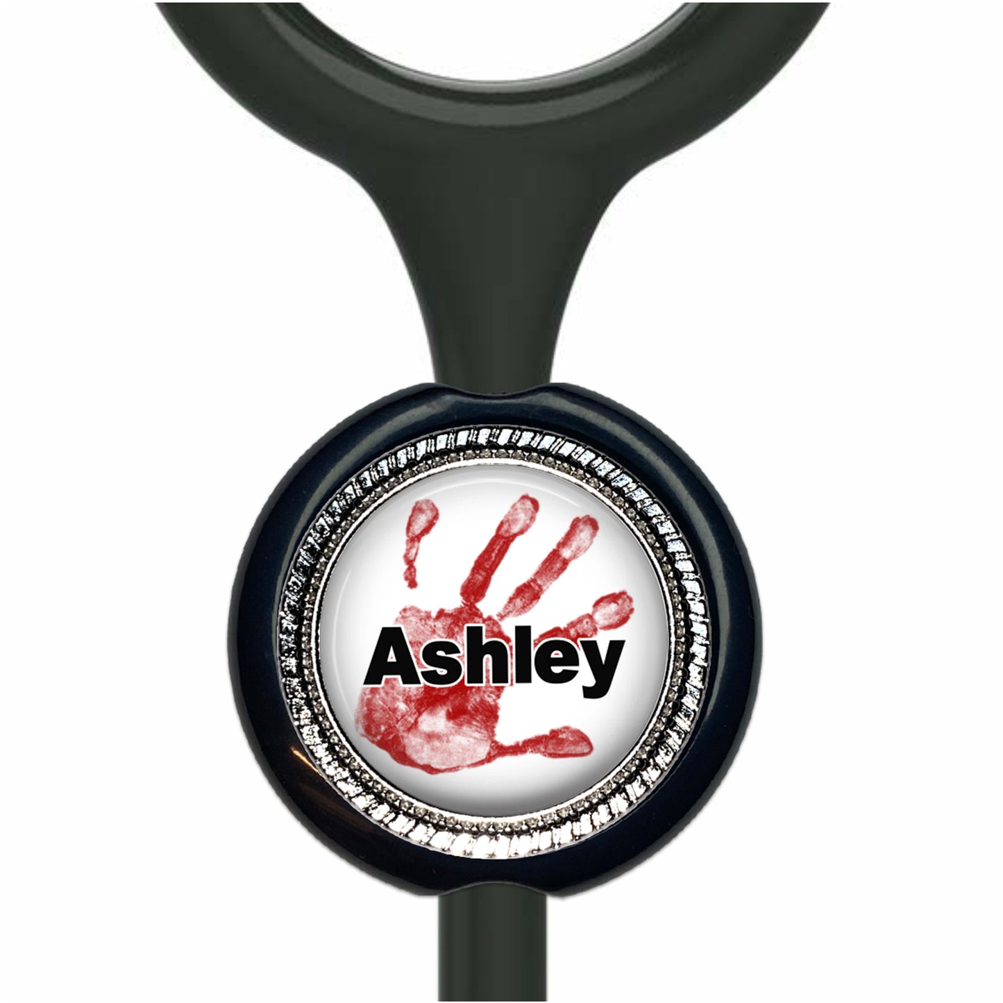 A black stethoscope with a round metal charm featuring a red handprint and the name "Ashley" written on it.