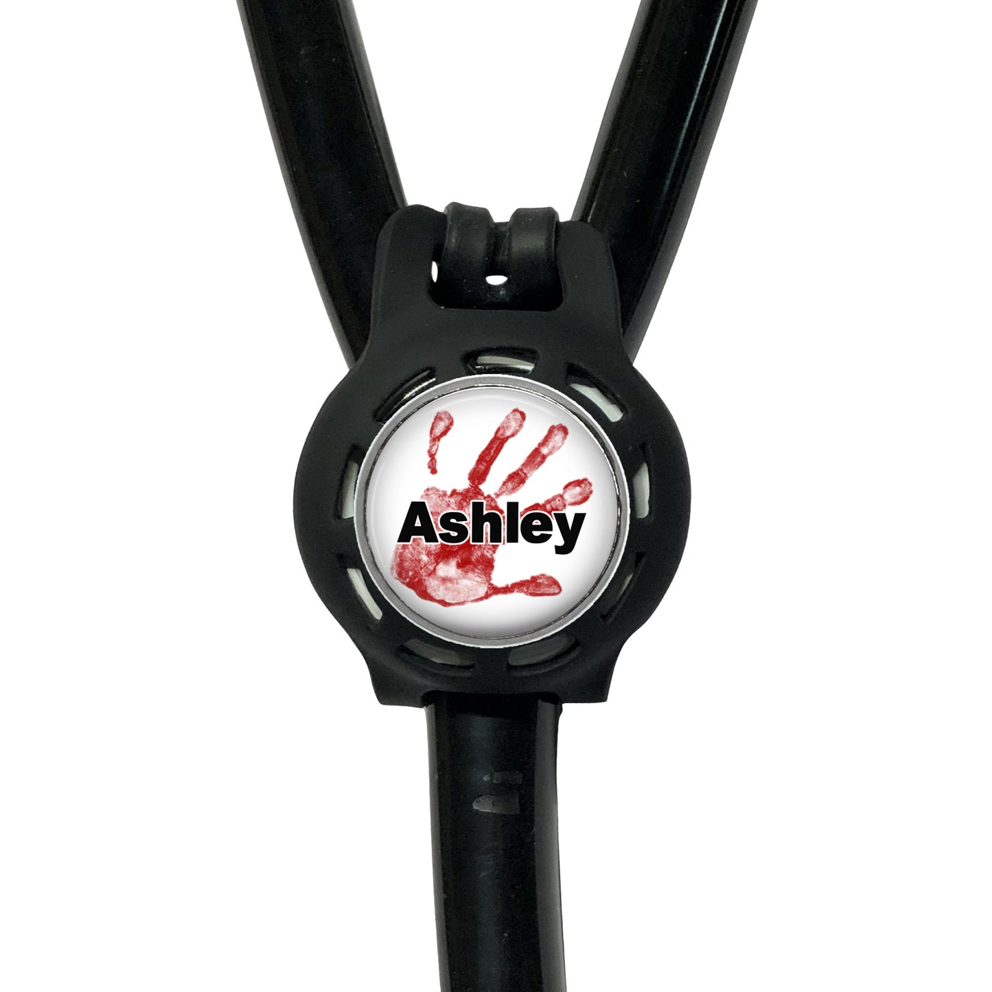 A black stethoscope with a personalized name badge attached to it.