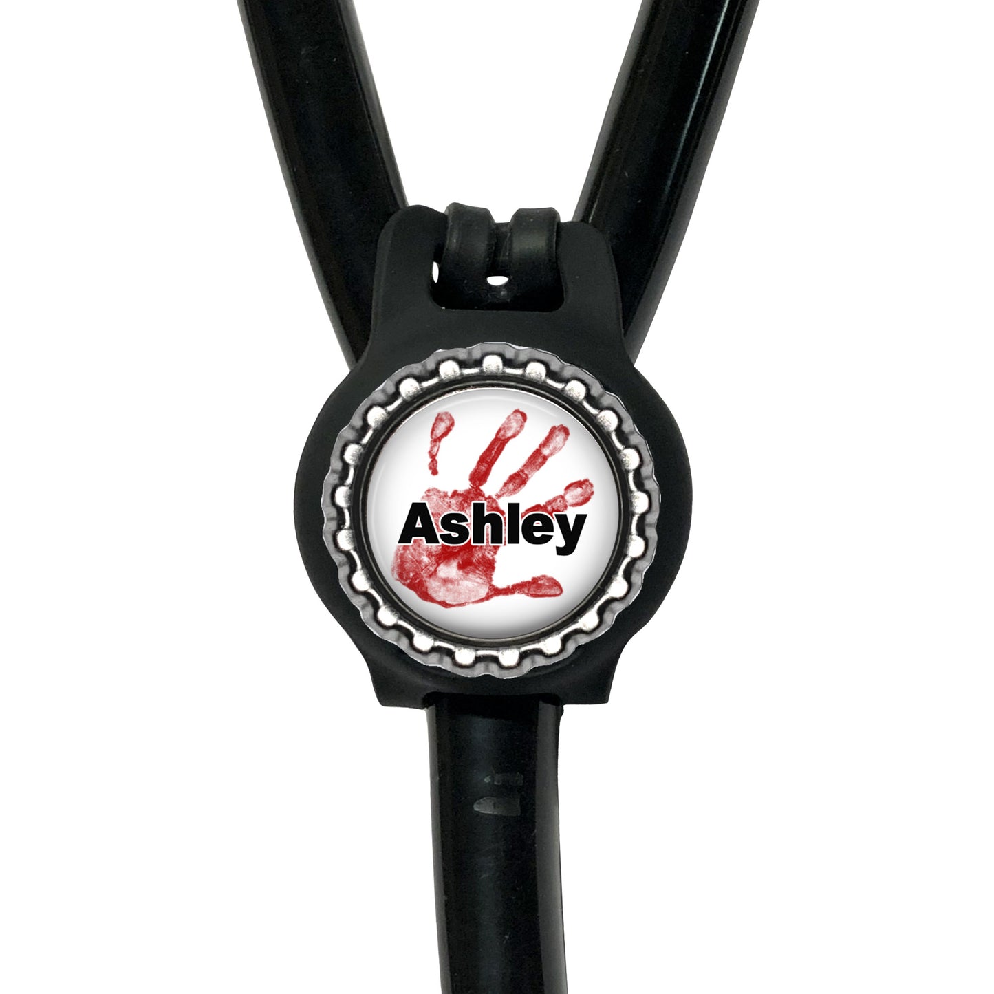 A black stethoscope with a personalized nameplate attached to it. The nameplate features a red handprint and the name "Ashley".