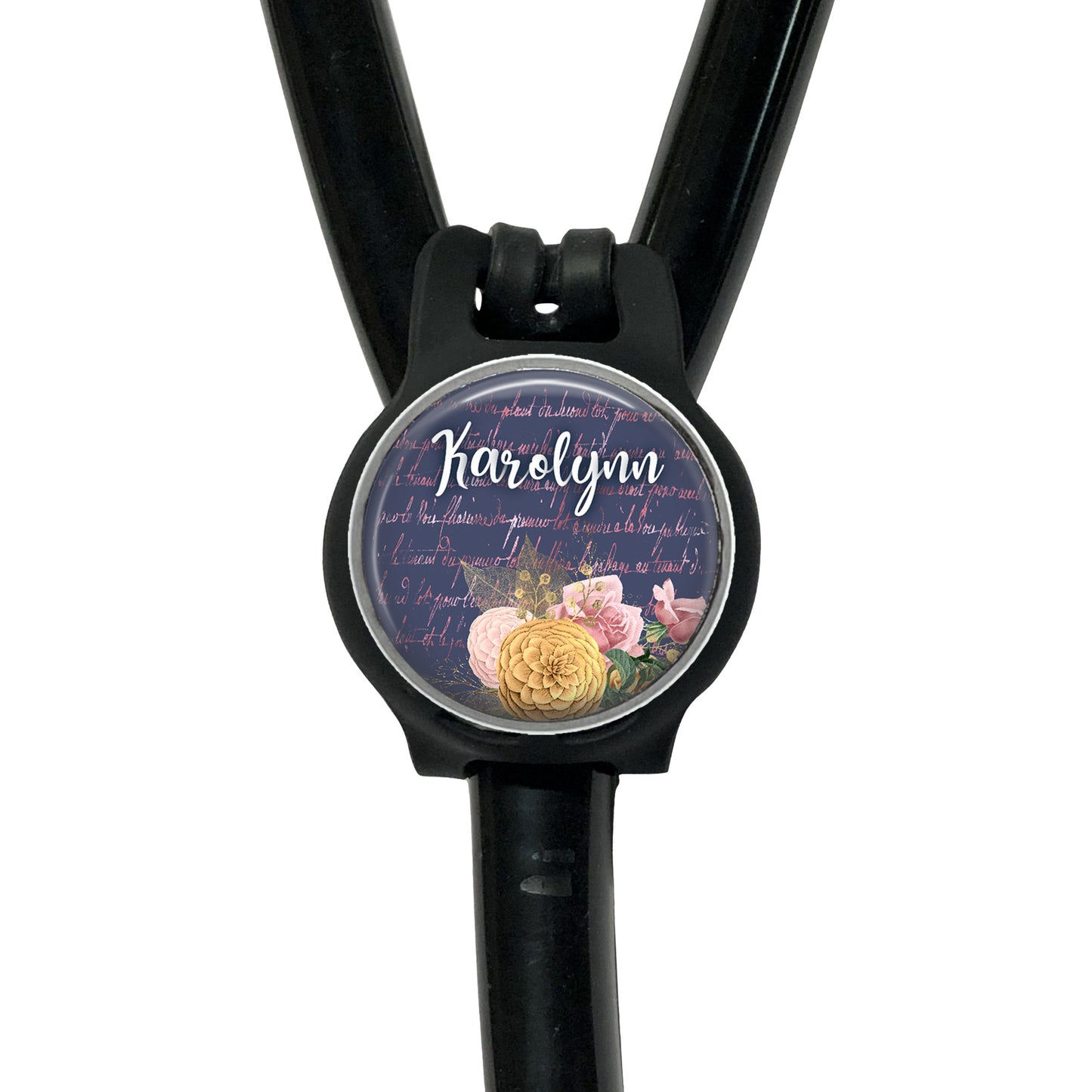 A black stethoscope with a round, personalized name badge attached to it.