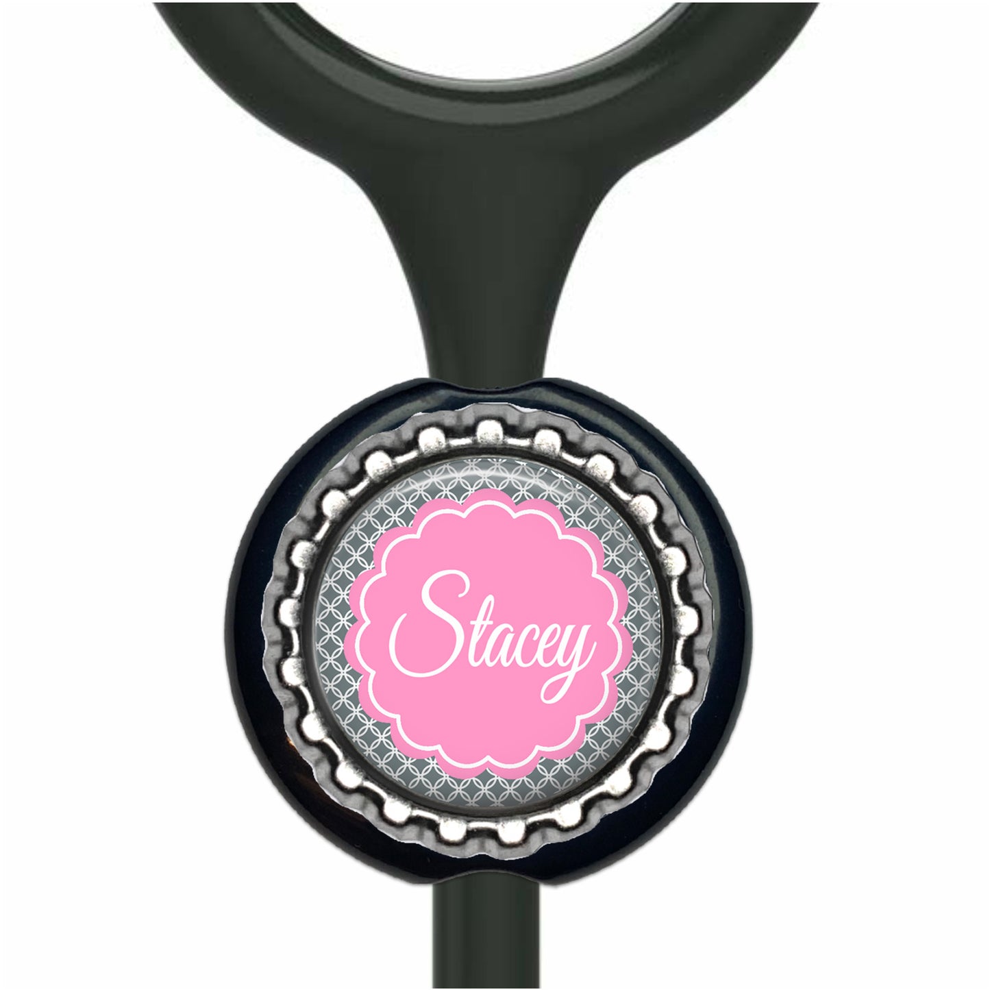 A black stethoscope with a personalized name label attached to it.