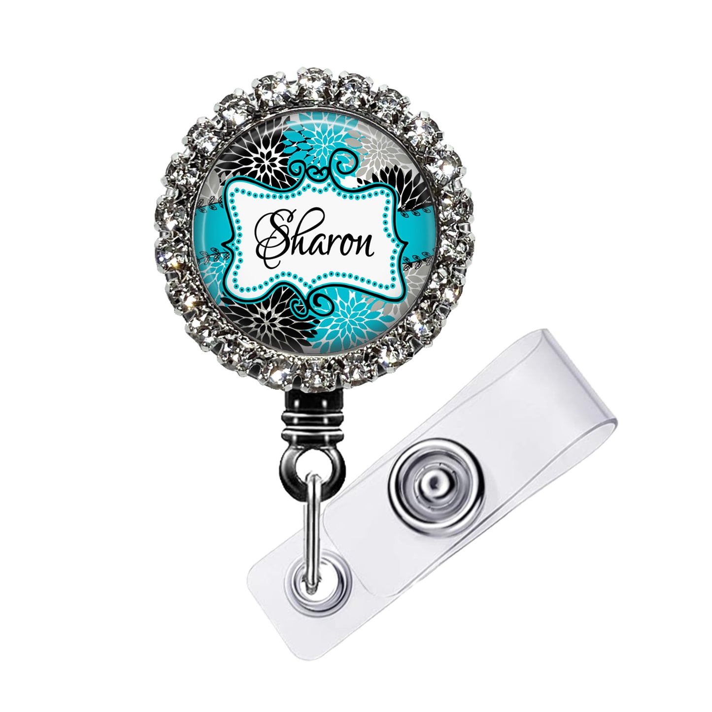 A personalized name badge with a nameplate and a clear badge holder attached to it.