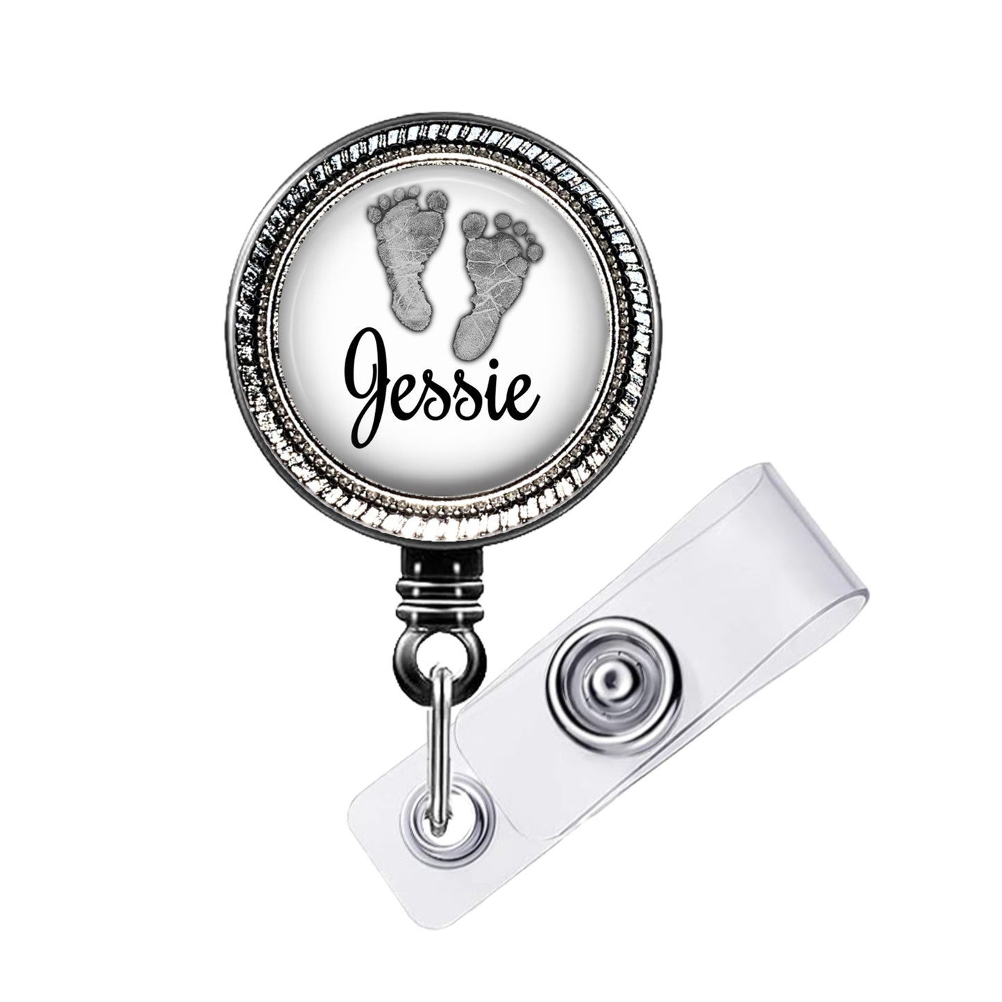 A badge holder with a personalized name tag and a baby footprint design.
