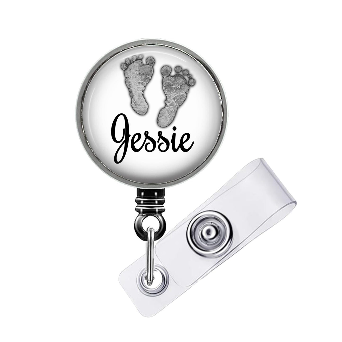 A round badge holder with a name tag attached to it. The name tag has the name "JESSIE" printed on it.