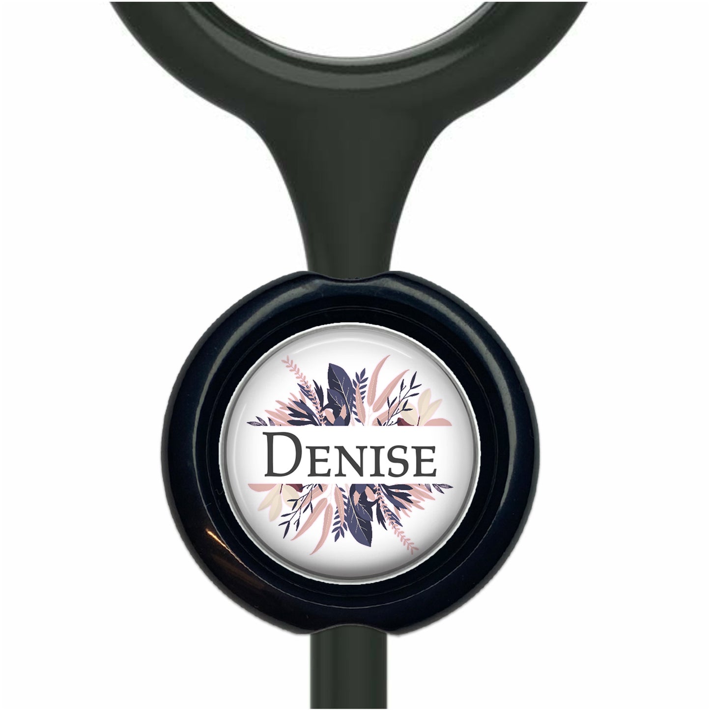 A black stethoscope with a round, black and white label featuring a floral design and the name "Denise".