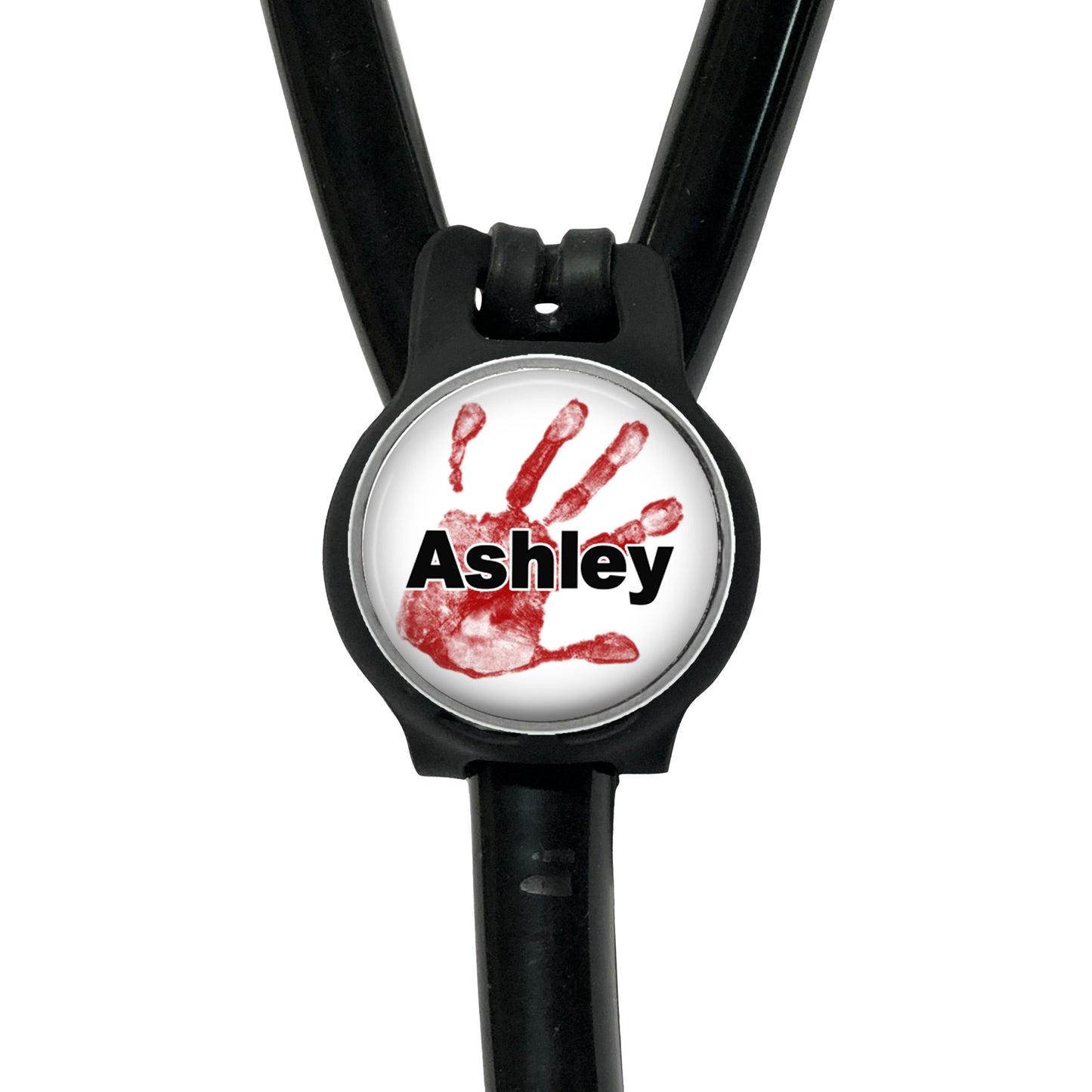 A black stethoscope with a round metal clip featuring a red handprint and the name "Ashley" written on it.