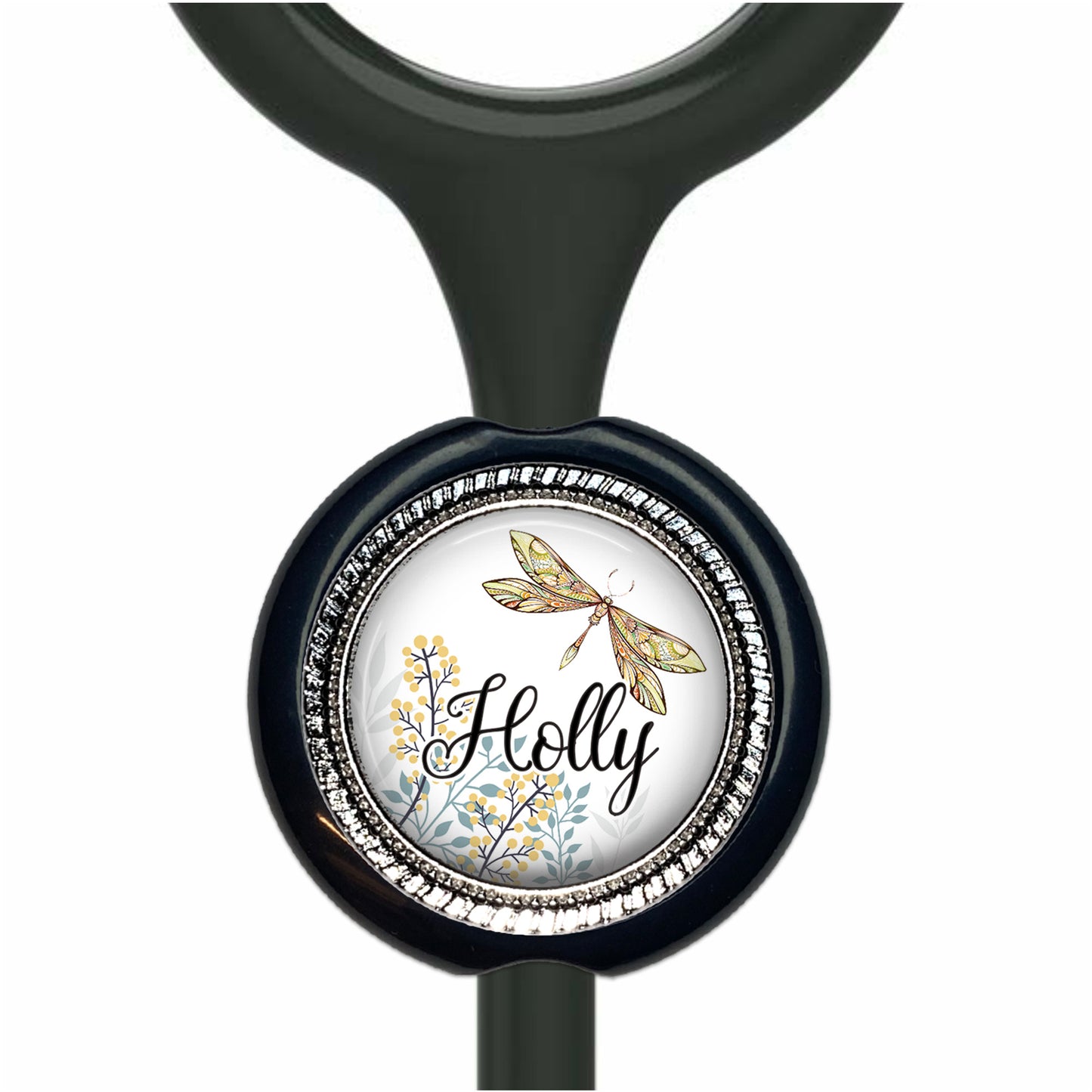 A black stethoscope with a round, decorative charm featuring a dragonfly and floral elements.