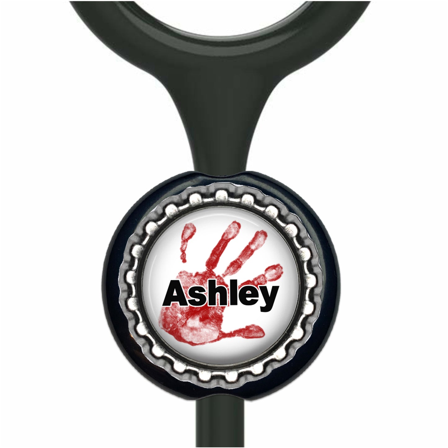 A black stethoscope with a black and silver cap-shaped charm featuring a red handprint and the name "Ashley" written on it.
