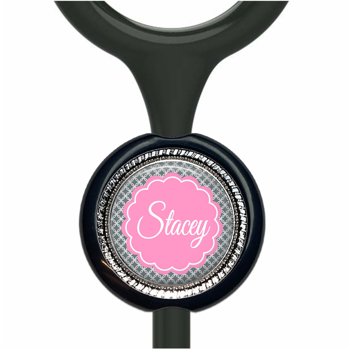 A black stethoscope with a personalized nameplate attached to it.
