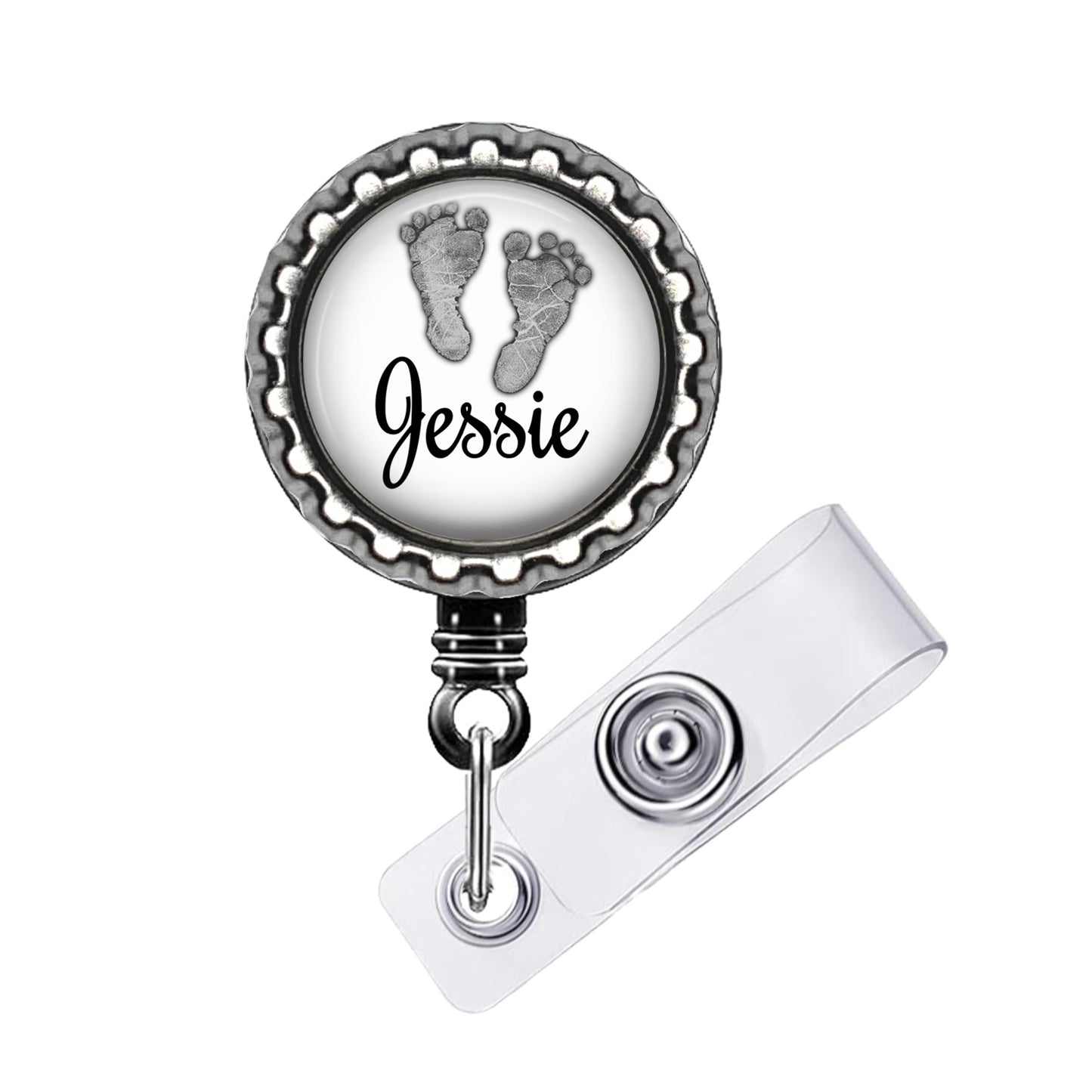 A badge holder with a personalized name tag and a baby footprint design.