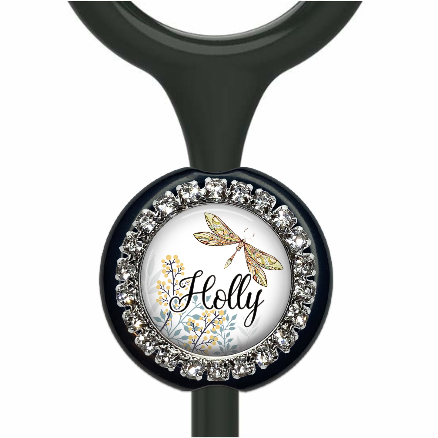 A black stethoscope with a round, decorative charm featuring a dragonfly and floral elements.