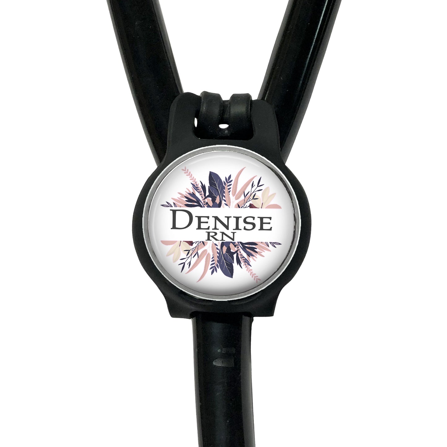 A black stethoscope with a round, personalized name badge attached to it.