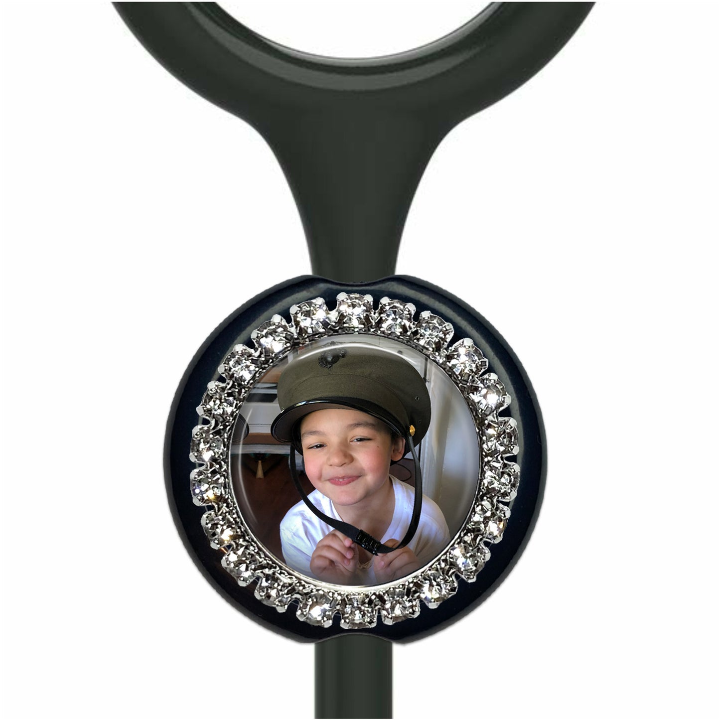 A young boy wearing a helmet and smiling at the camera.