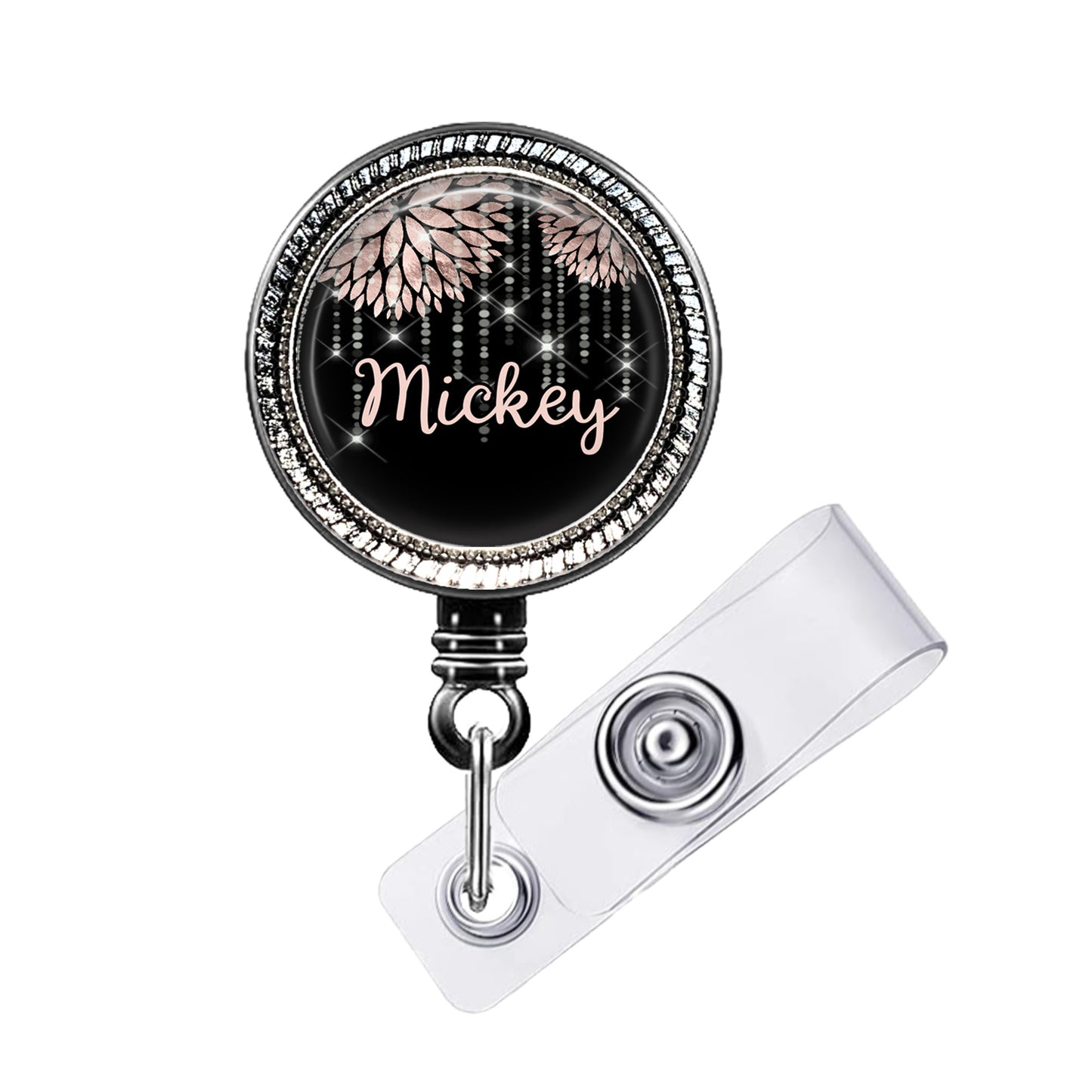 A black and silver badge holder with a personalized name tag attached.