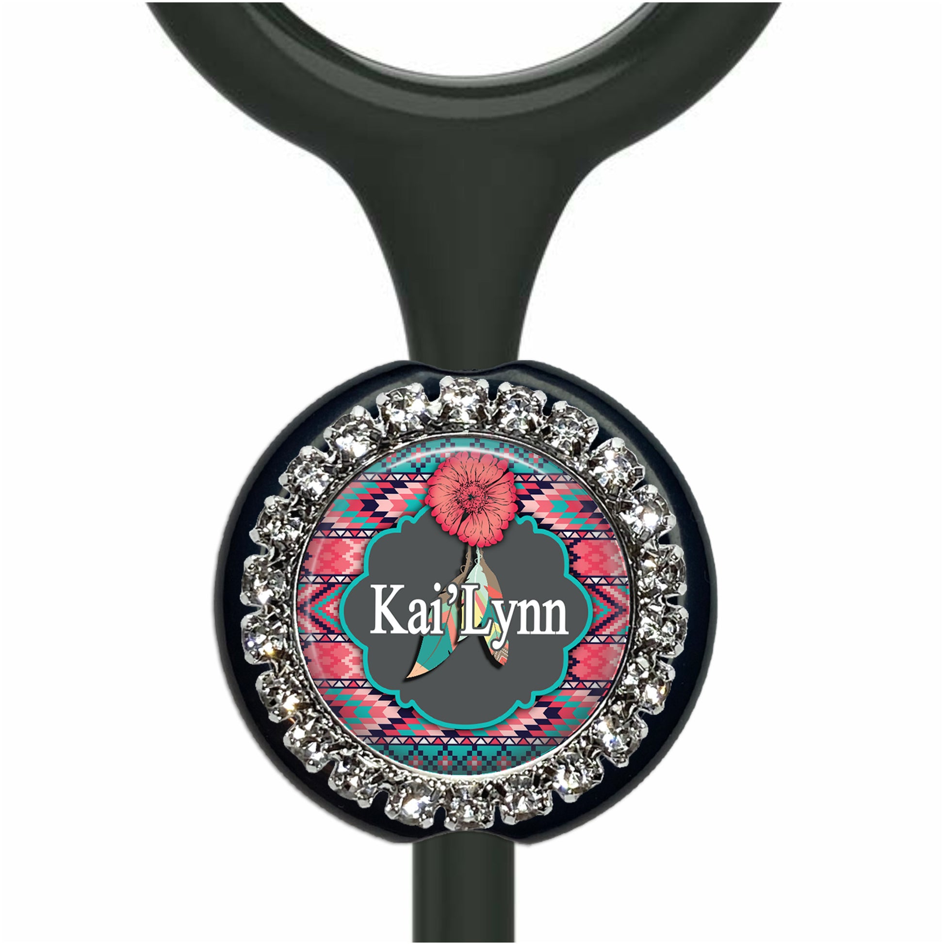 A personalized nameplate with a colorful design and rhinestones around the edge.