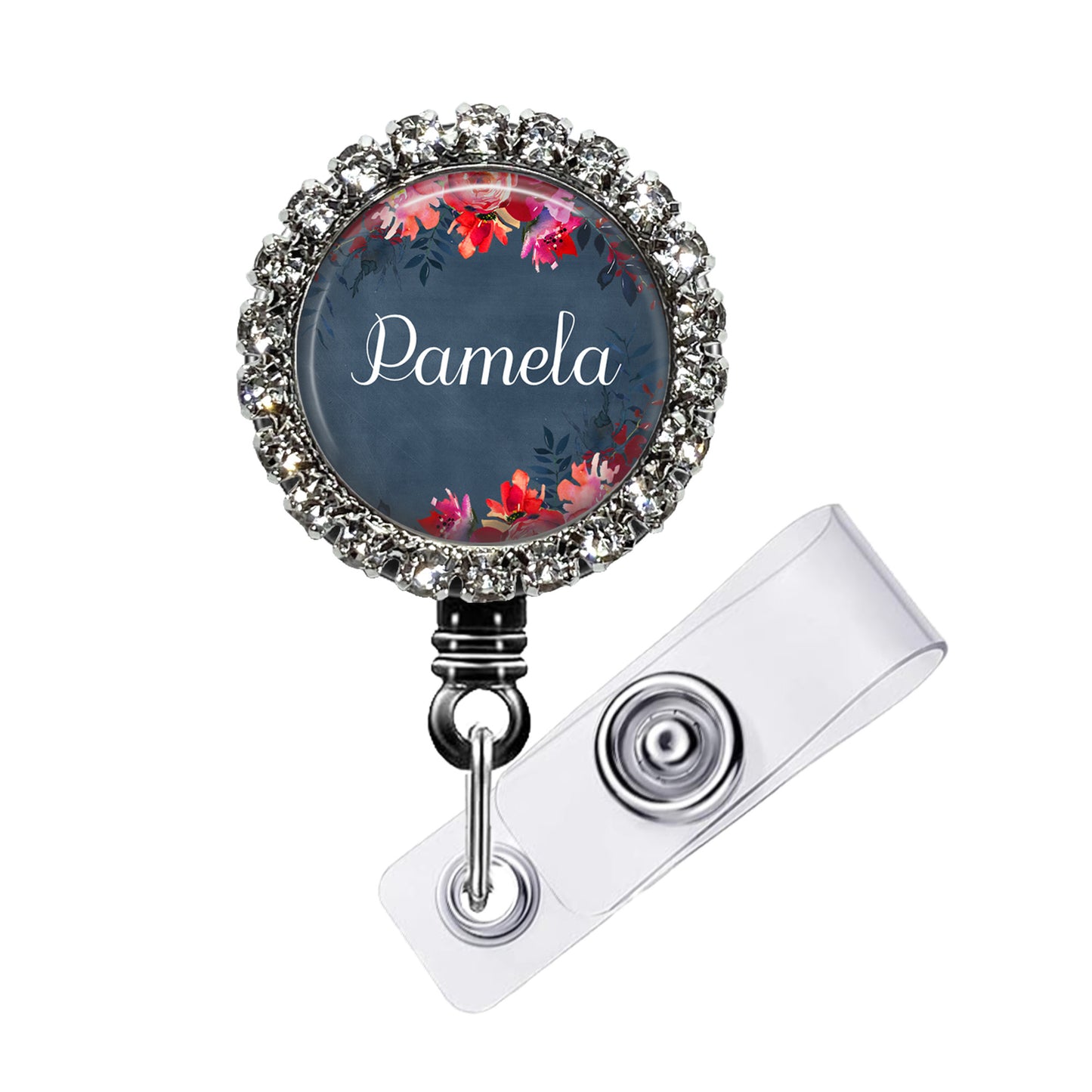 A personalized name badge with a floral design and a rhinestone-encrusted frame.