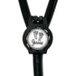 A black stethoscope with a personalized name badge attached to it.