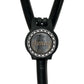 A black stethoscope with a silver circular badge on the handle.
