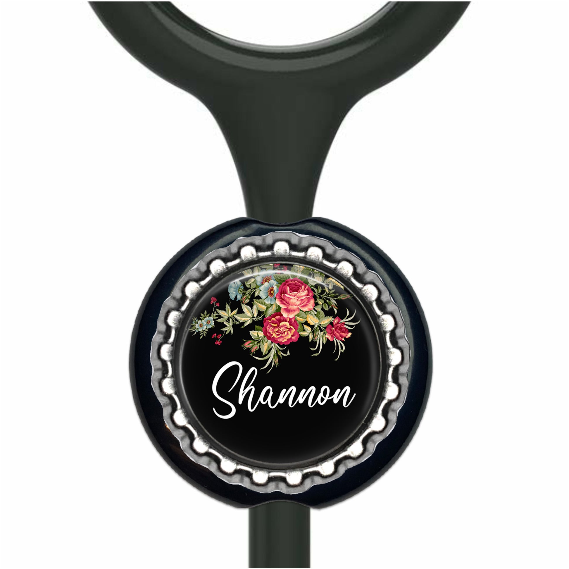A black stethoscope with a personalized nameplate featuring a floral design and the name "Shannon".