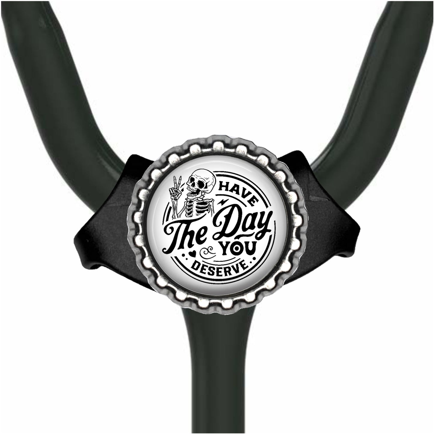 A black and white image of a stethoscope with a circular badge featuring a skull and the text "The Day You Deserve".