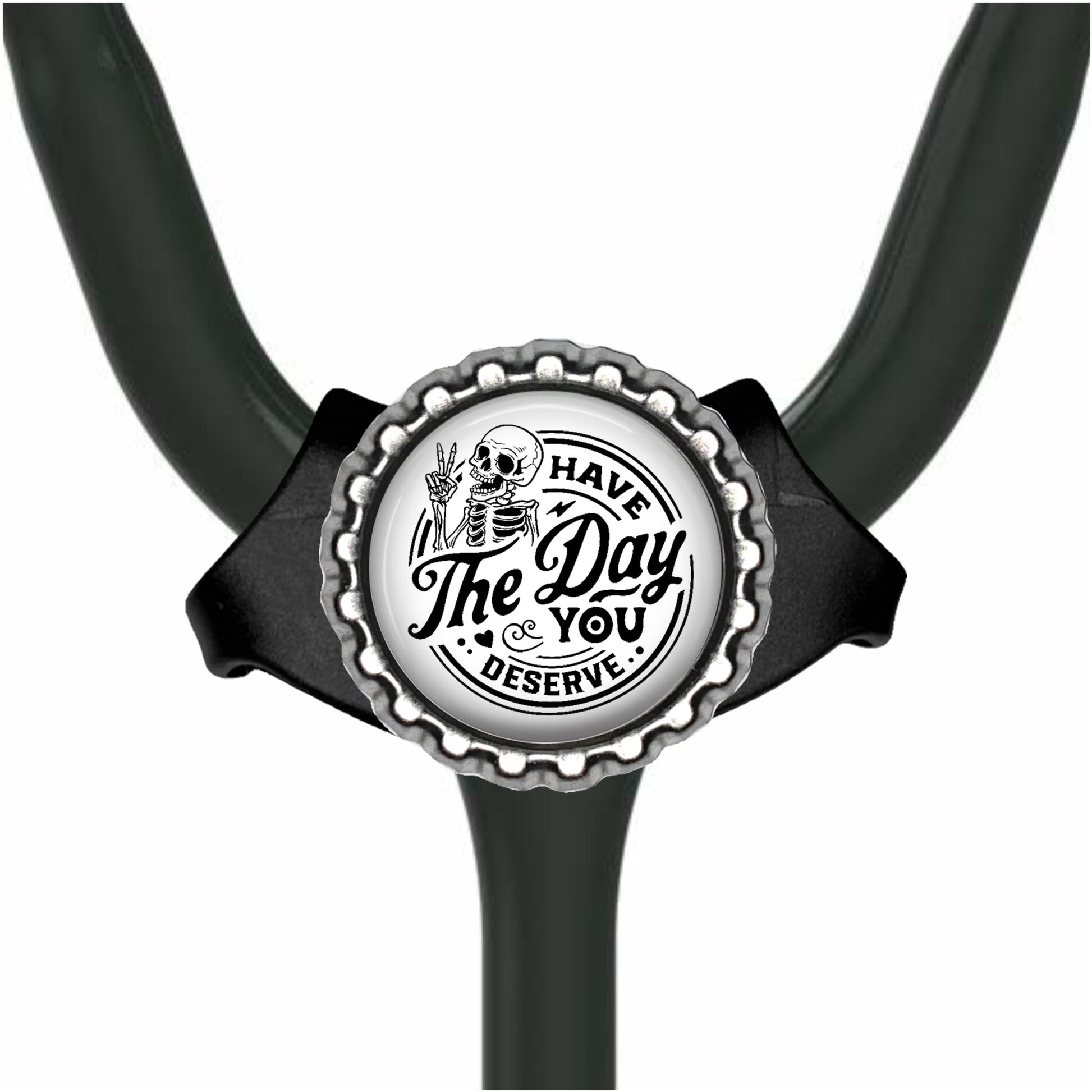 A black and white image of a stethoscope with a circular badge featuring a skull and the text "The Day You Deserve".