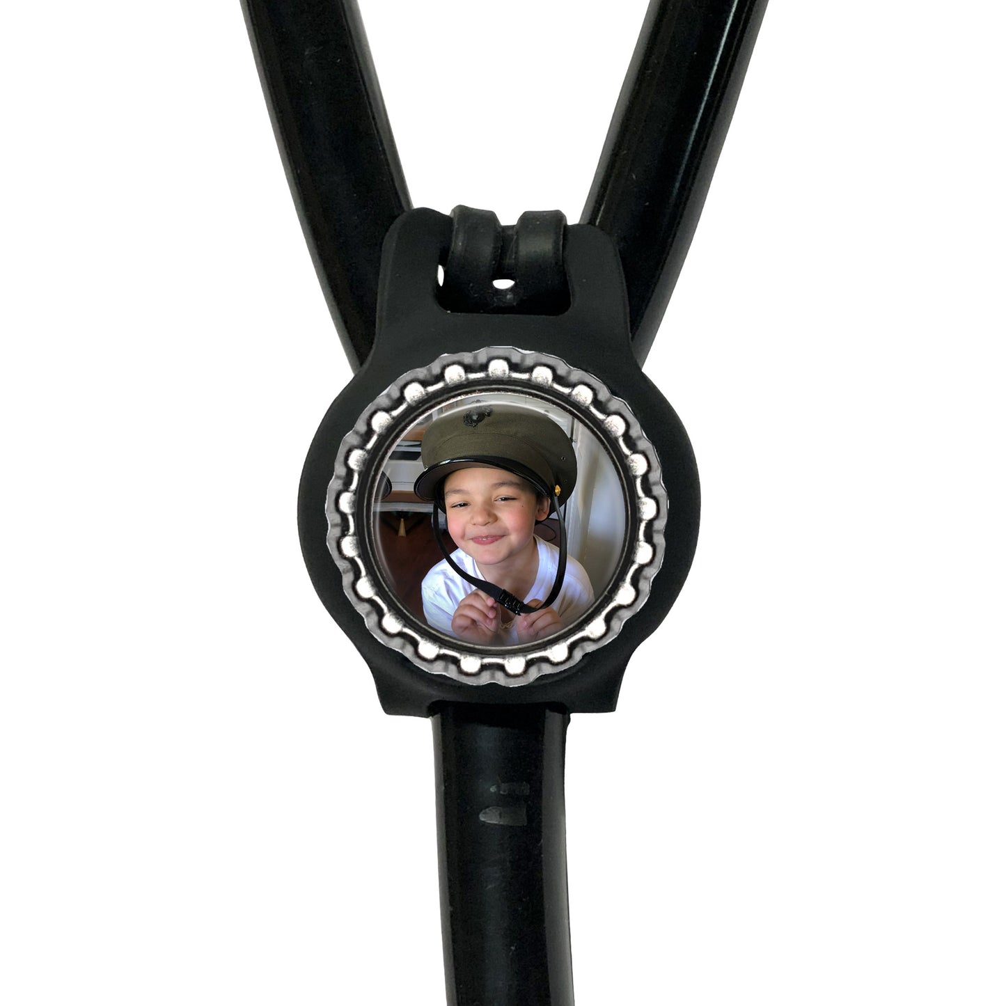 A black stethoscope with a circular frame containing a photo of a smiling young boy.