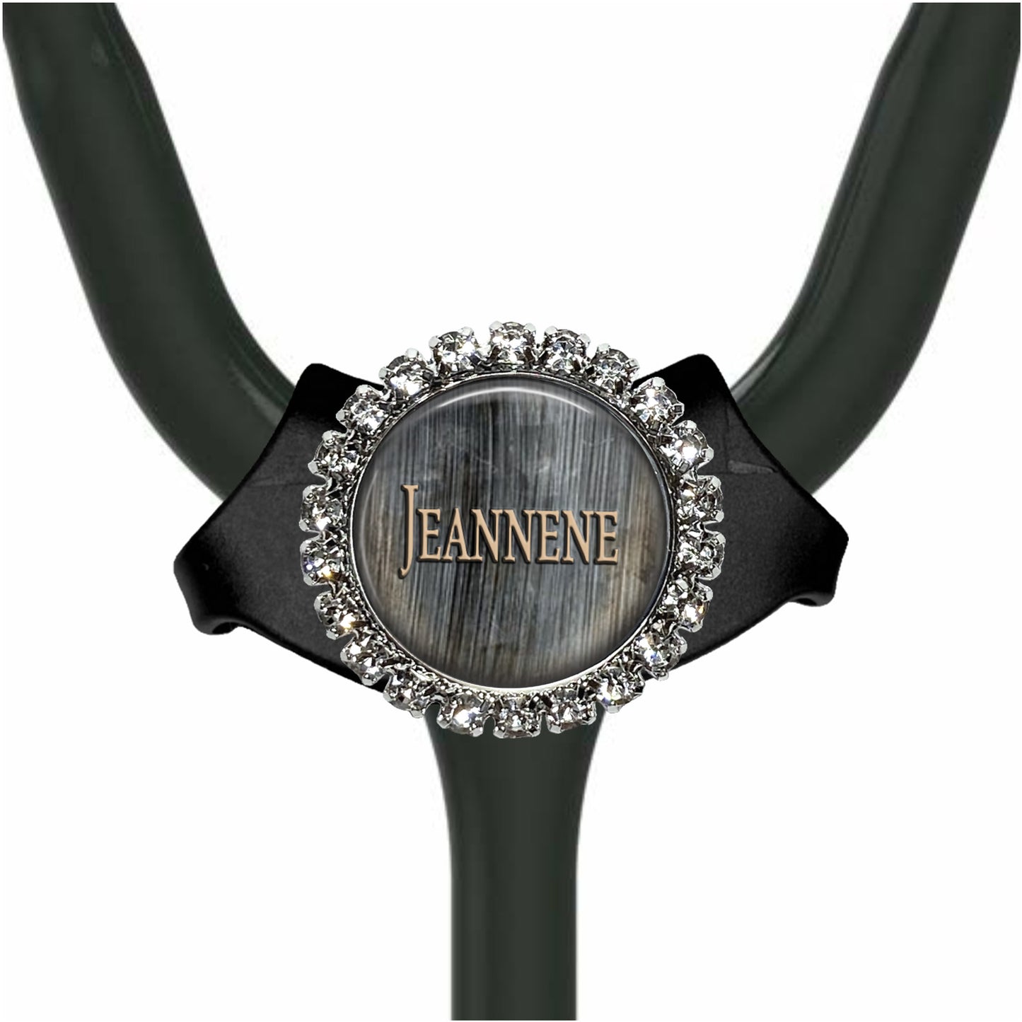 A black stethoscope with a silver and crystal-encrusted name tag attached to it.