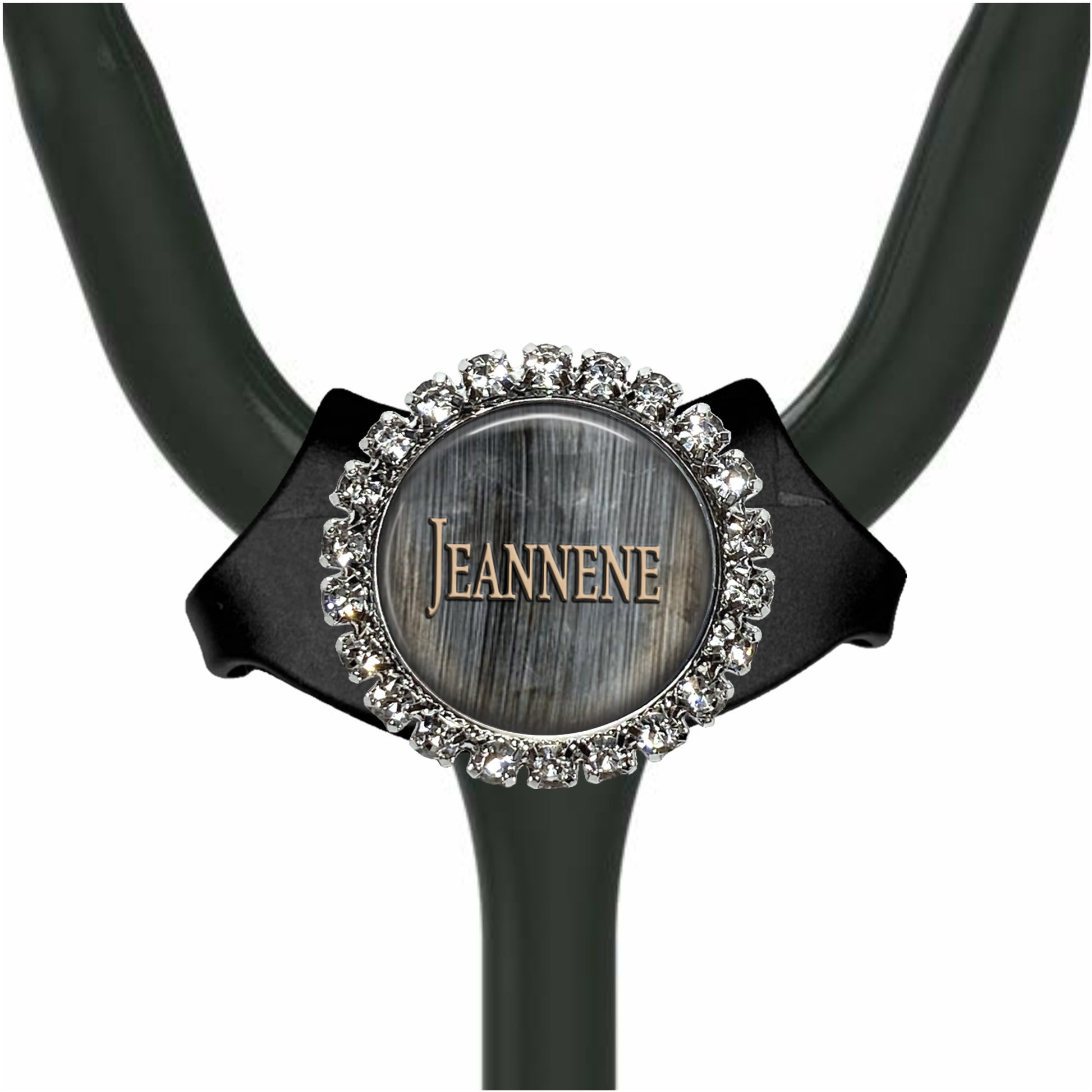 A black stethoscope with a silver and crystal-encrusted name tag attached to it.