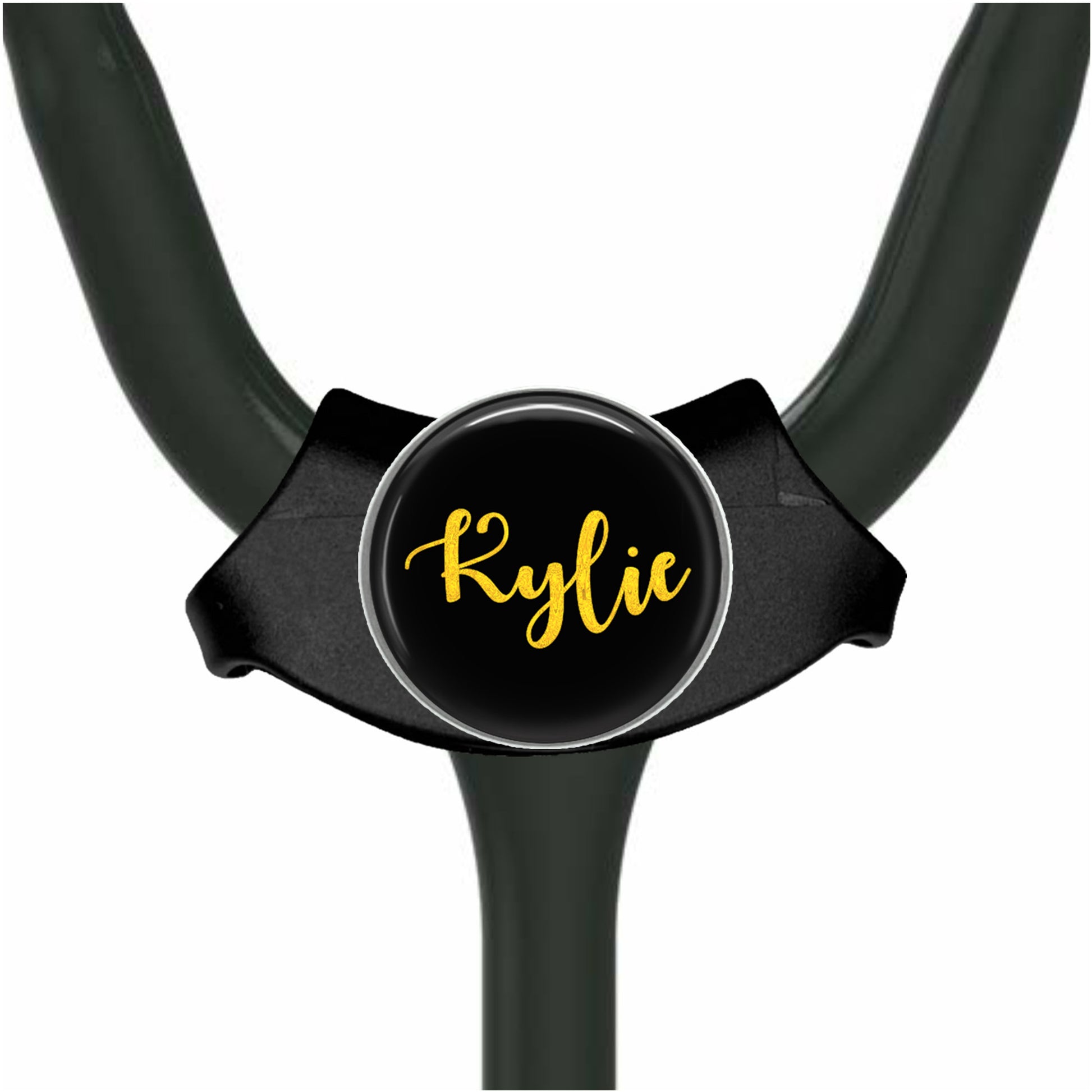 A black stethoscope with a personalized name badge attached to it.