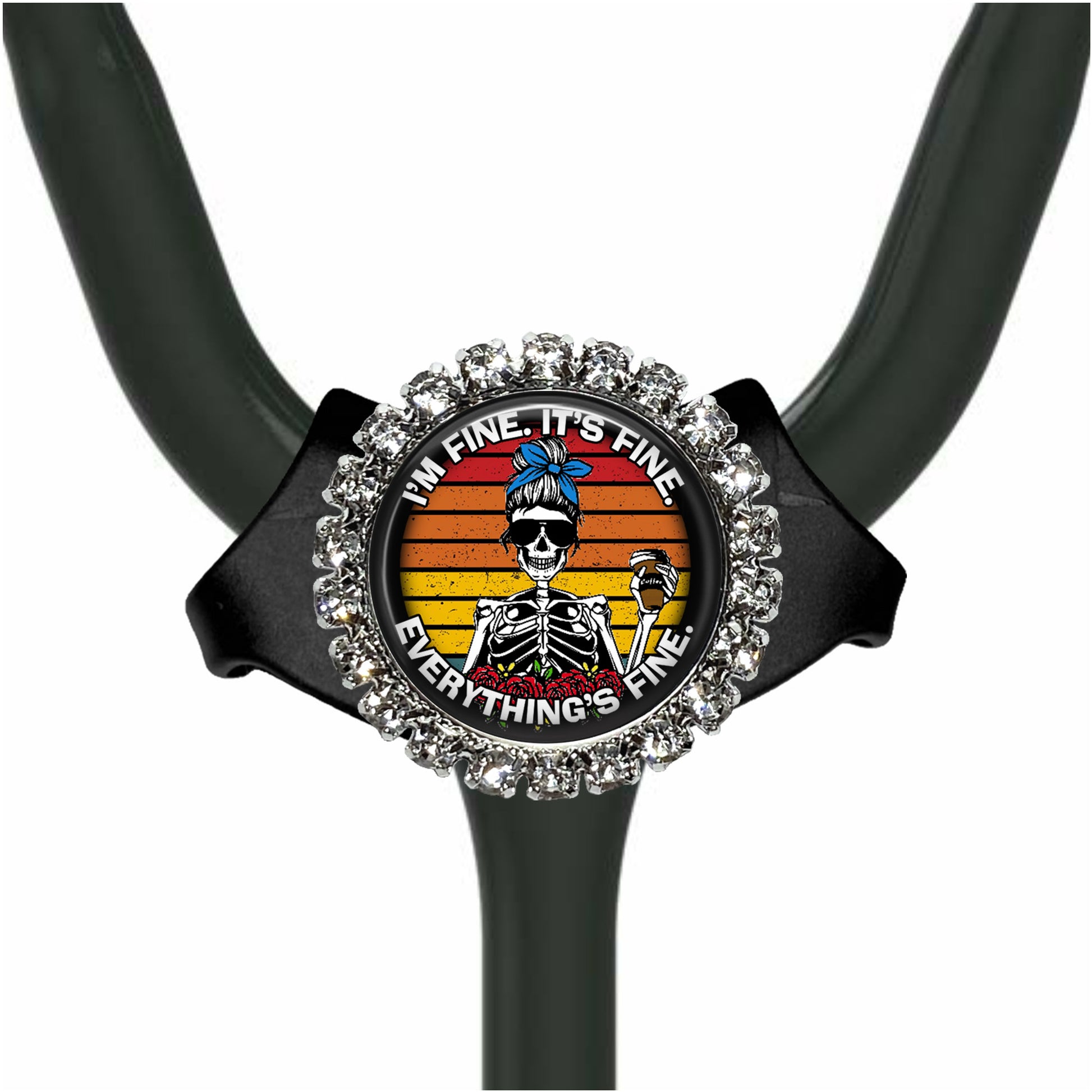 A black stethoscope with a decorative charm featuring a skeleton wearing a blue headband and the text "I'm fine, it's fine, everything's fine" around the charm.