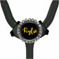 A black and silver stethoscope with a personalized name badge attached to it.