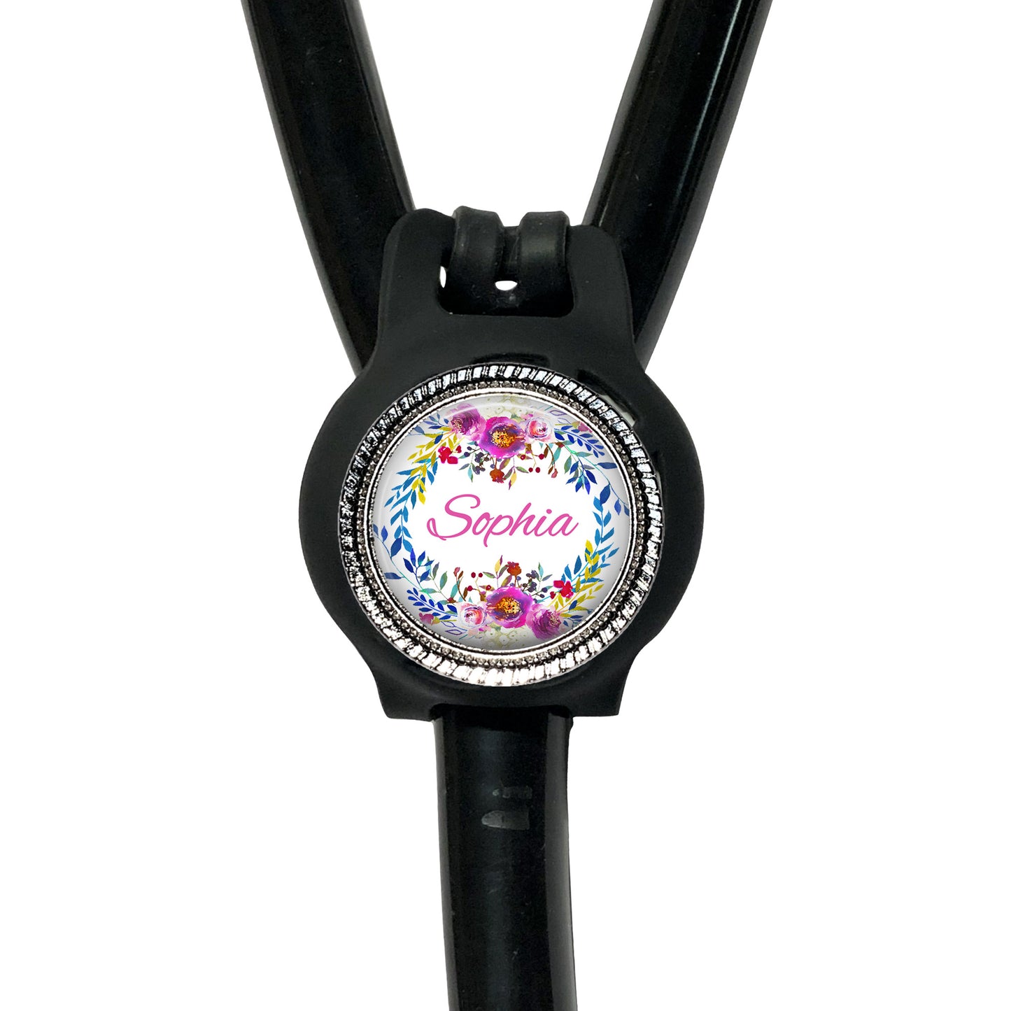 A black stethoscope with a personalized name badge attached to it.