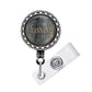 A metal badge with the name 'Jeanne' engraved on it, attached to a clear plastic holder.