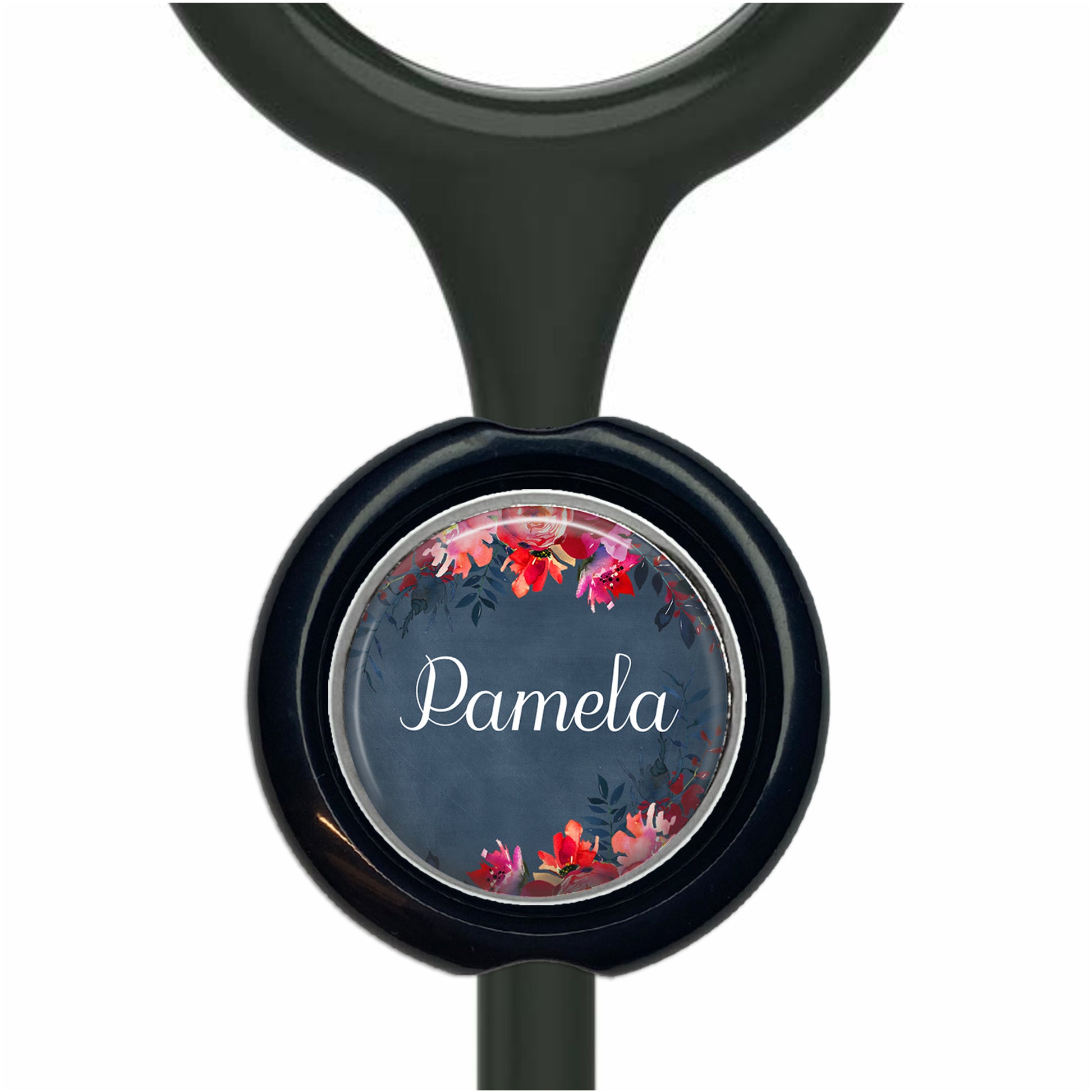 A black stethoscope with a circular charm featuring a floral design and the name "Pamela" written on it.