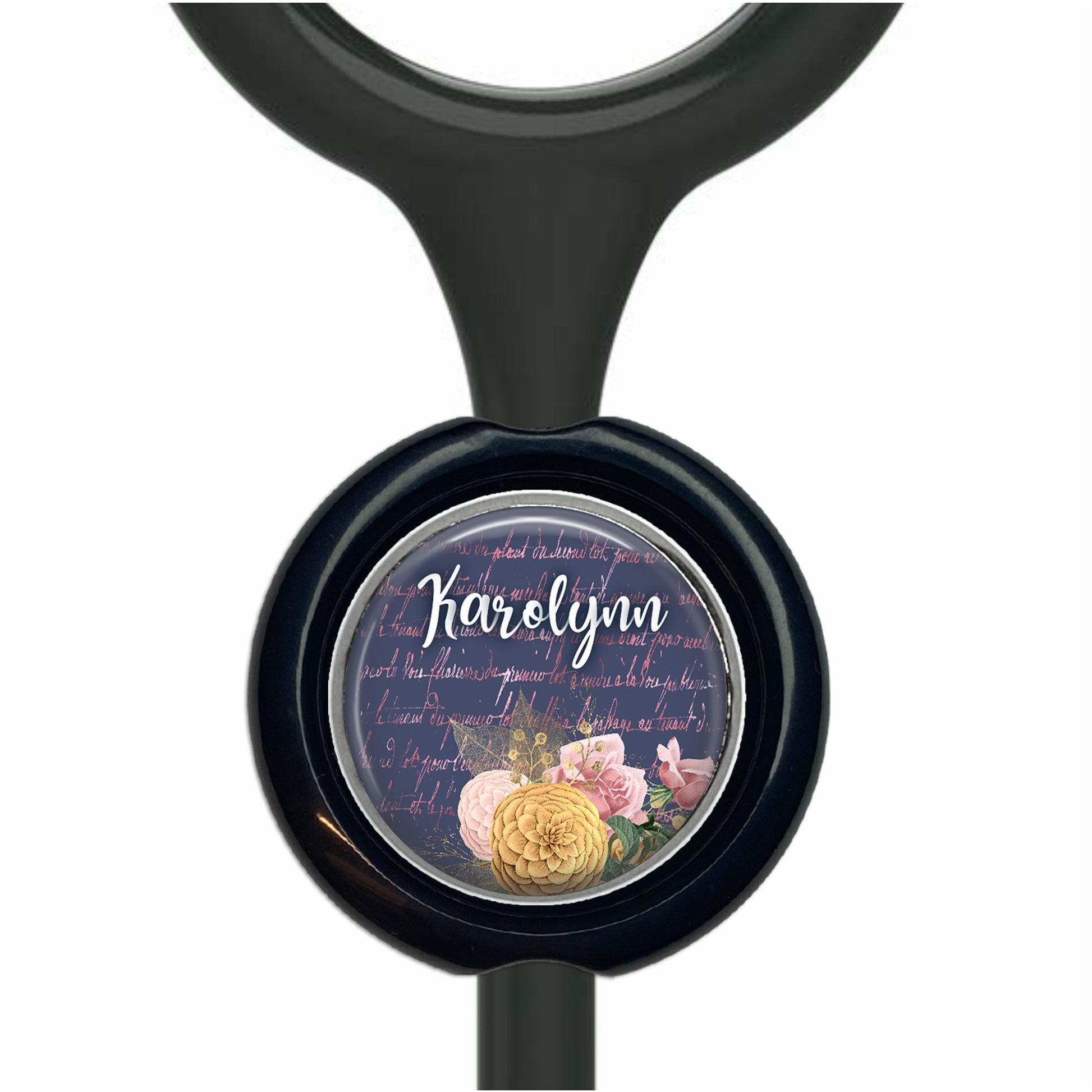 A black stethoscope with a round, circular charm featuring a floral design and the name "Karen" written on it.