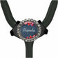 A black stethoscope with a personalized name badge on it.