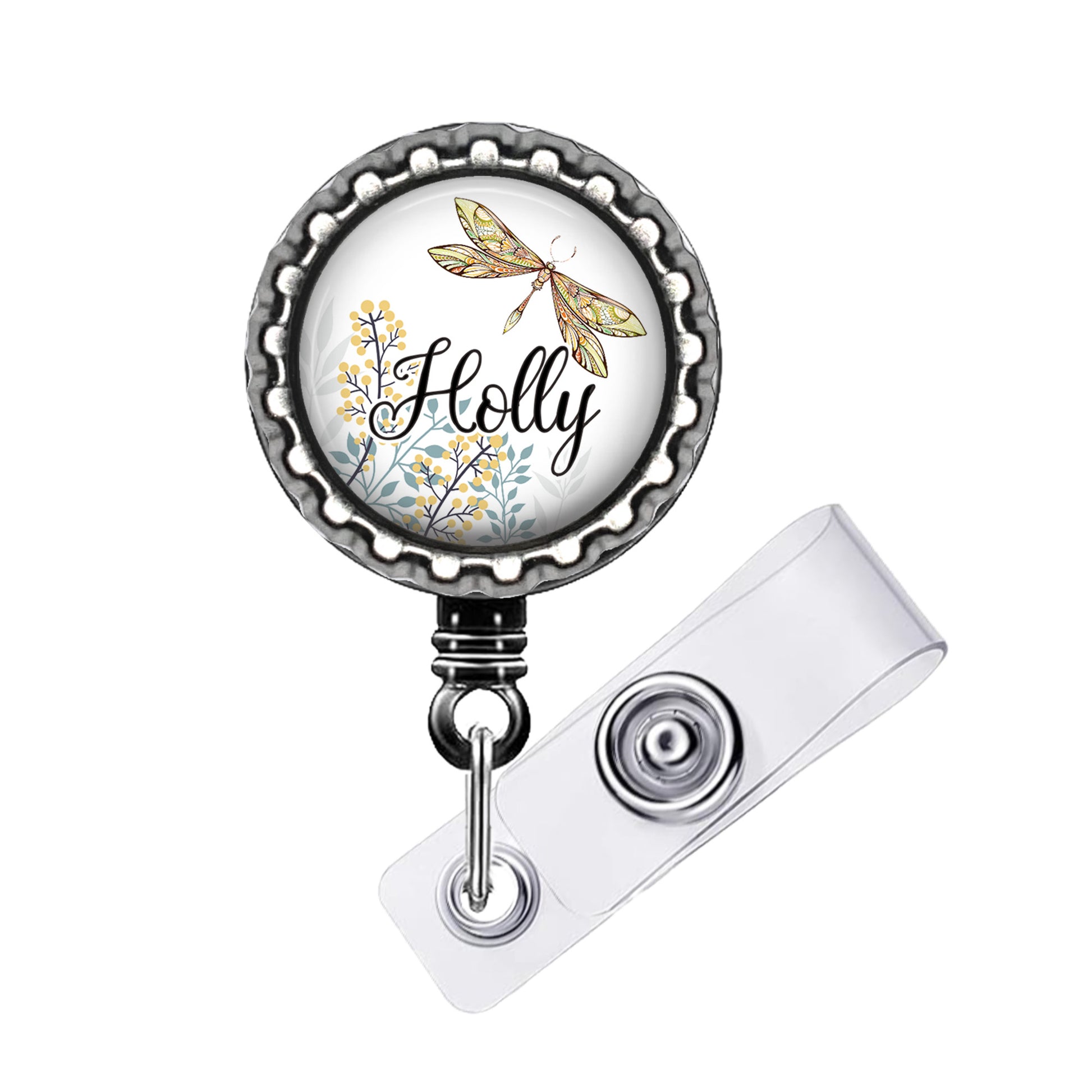 A round badge holder with a dragonfly design and the word "Holly" written on it.