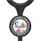 A personalized nameplate with a floral design and rhinestones around the edge.
