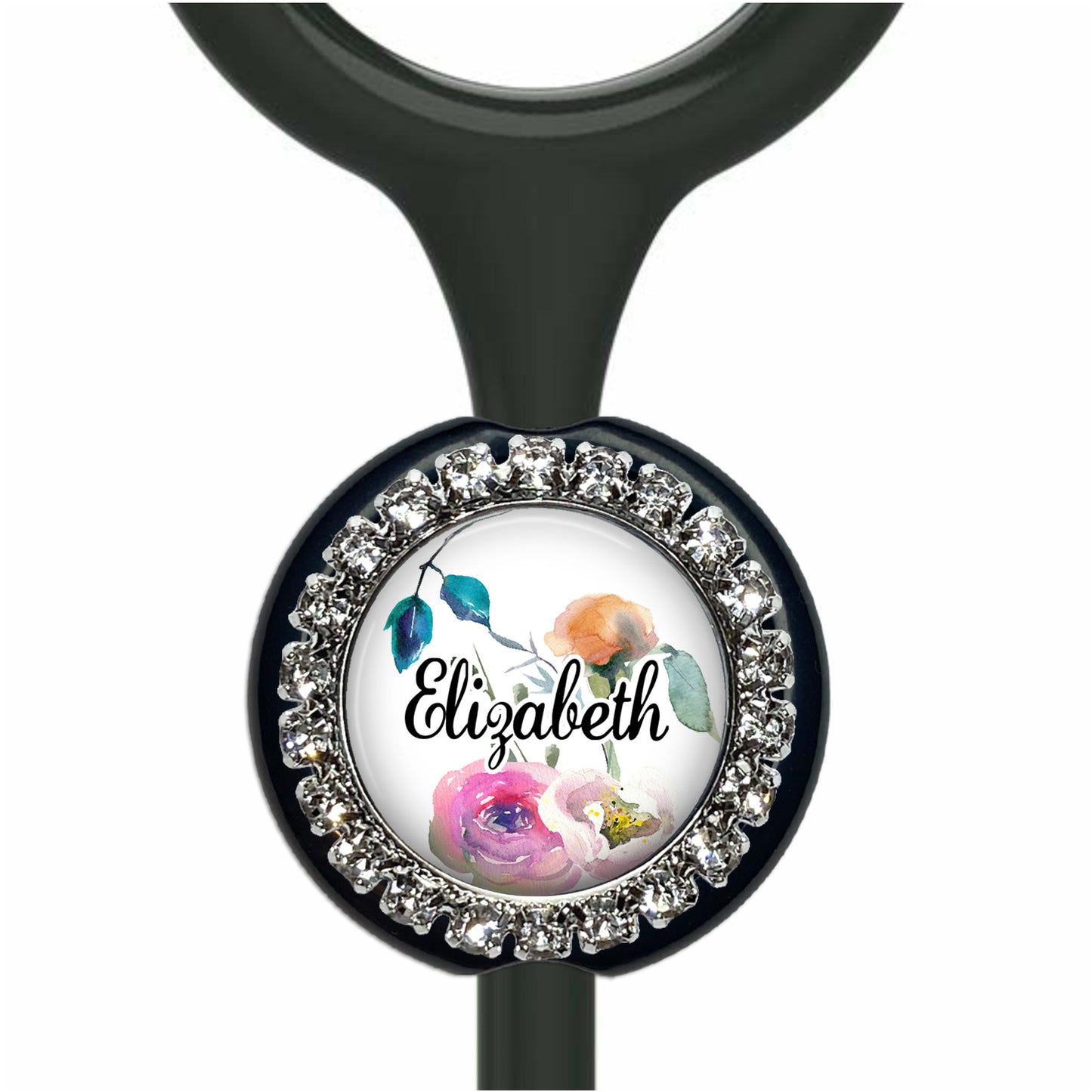 A personalized nameplate with a floral design and rhinestones around the edge.