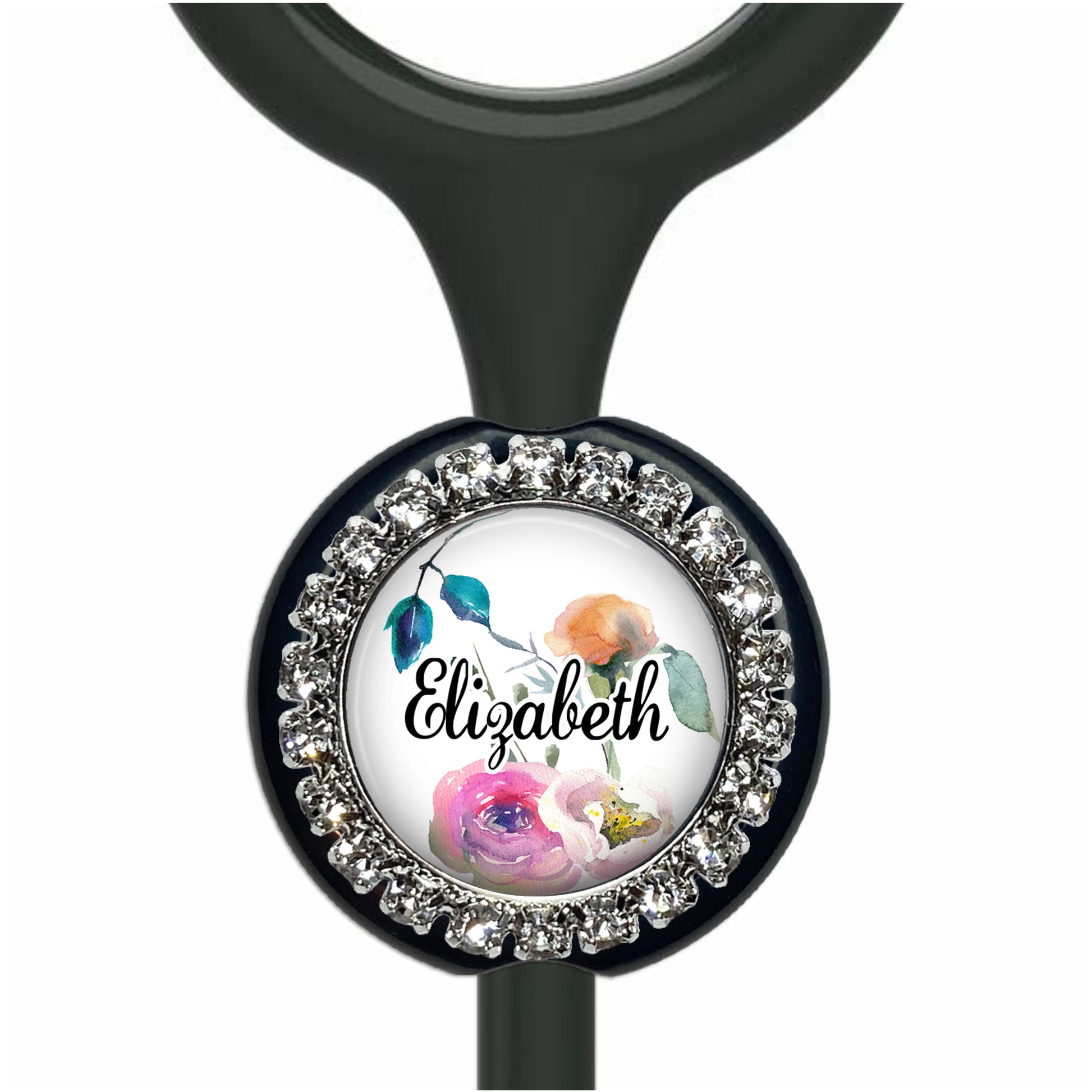 A personalized nameplate with a floral design and rhinestones around the edge.