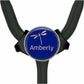 A blue stethoscope with a personalized name badge attached to it.