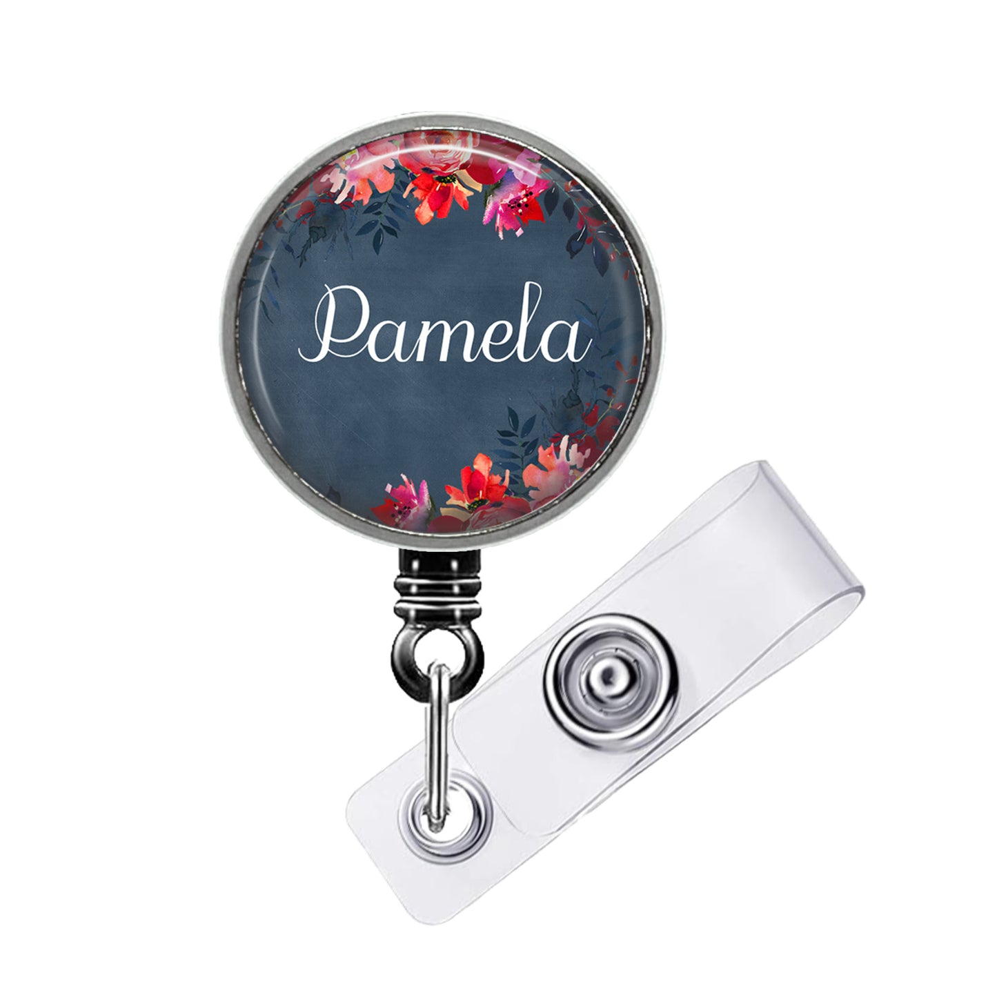 A round badge holder with a floral design and the name "Pamela" printed on it.