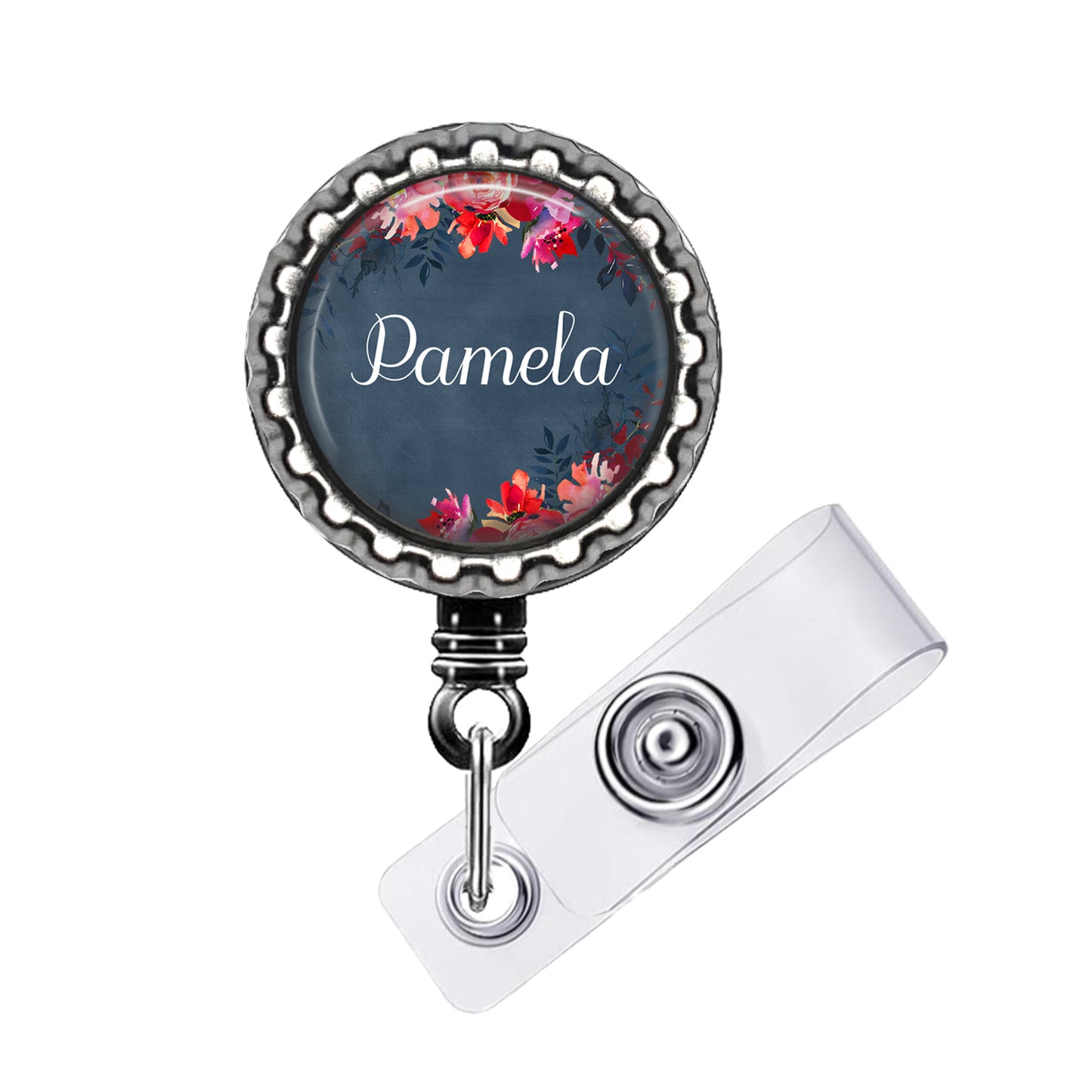 A round badge holder with a floral design and the name "Pamela" printed on it.