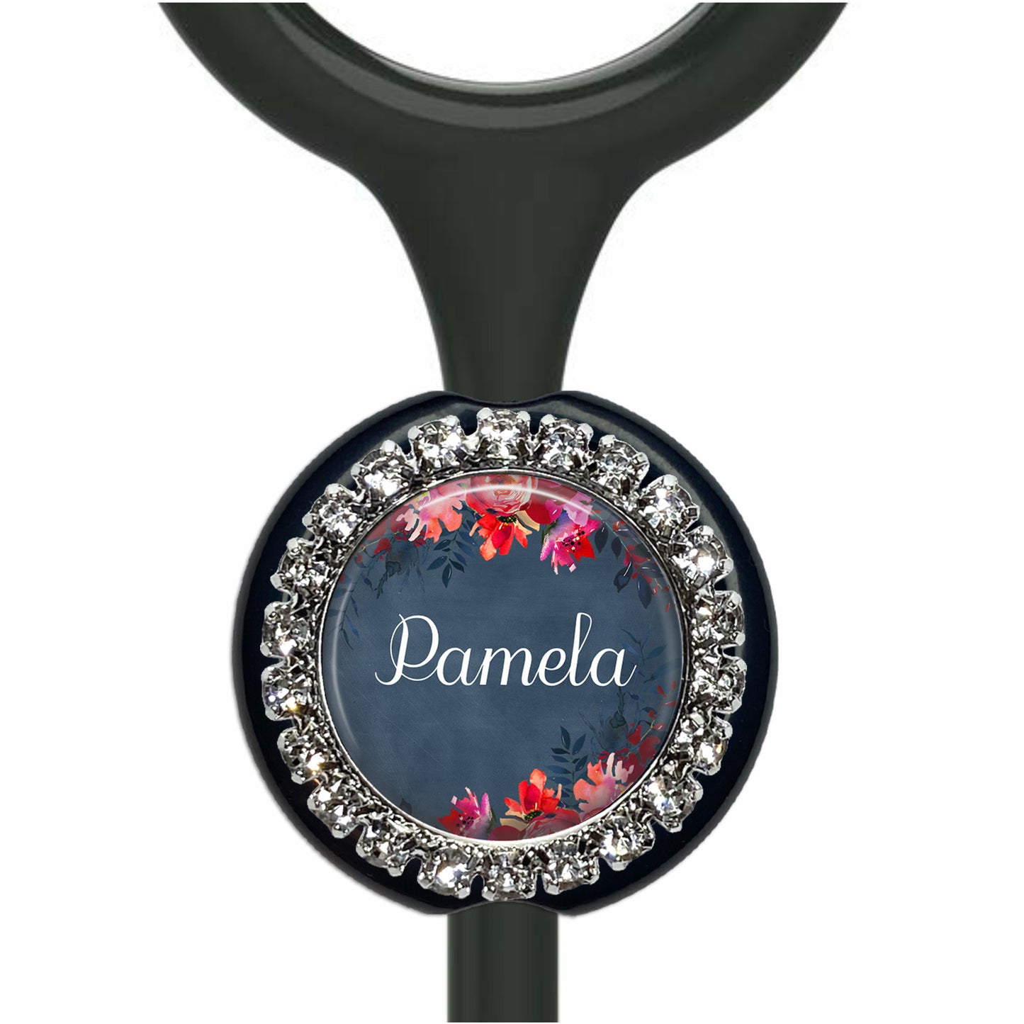 A personalized nameplate with a floral design and rhinestones, attached to a black stethoscope.