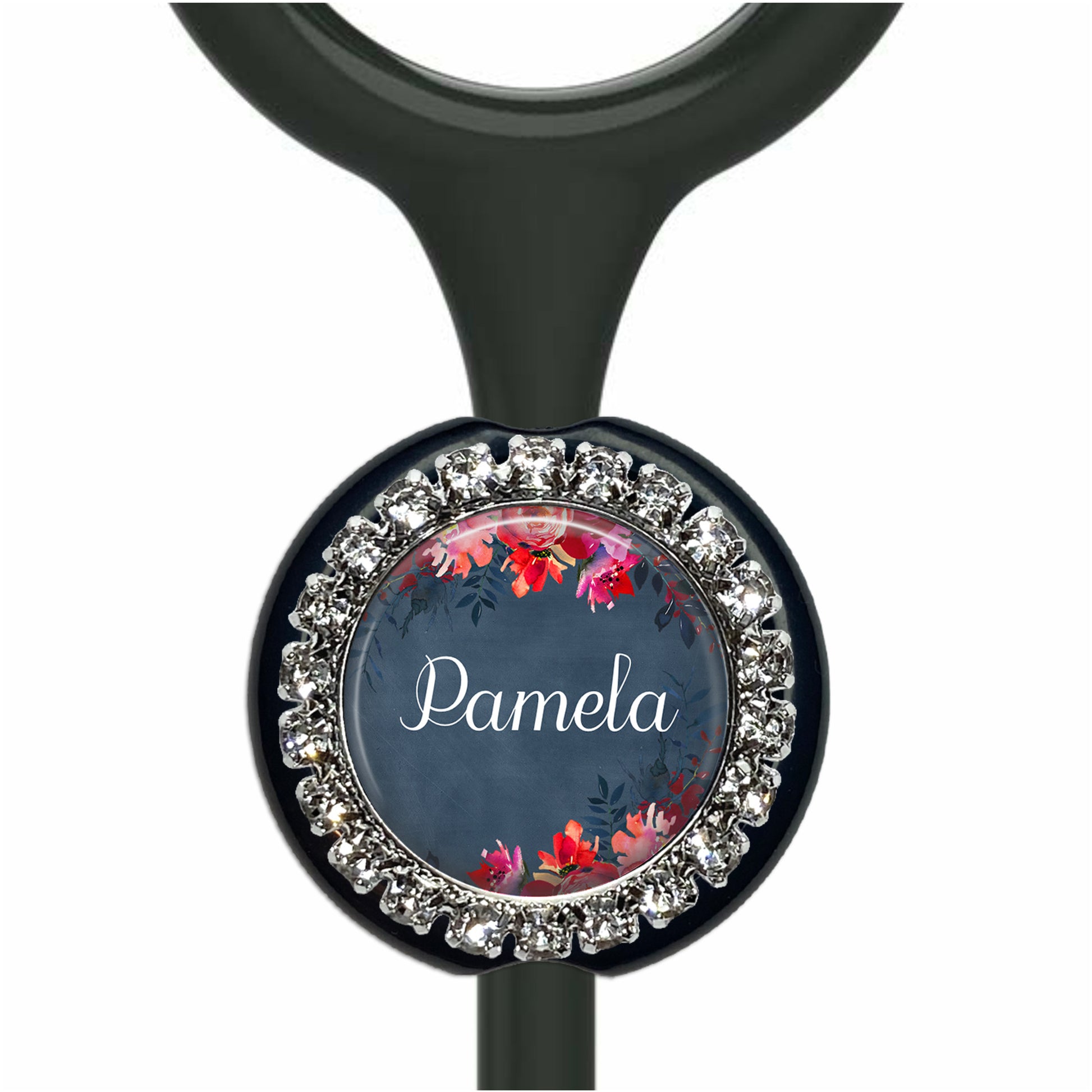 A personalized nameplate with a floral design and rhinestones, attached to a black stethoscope.