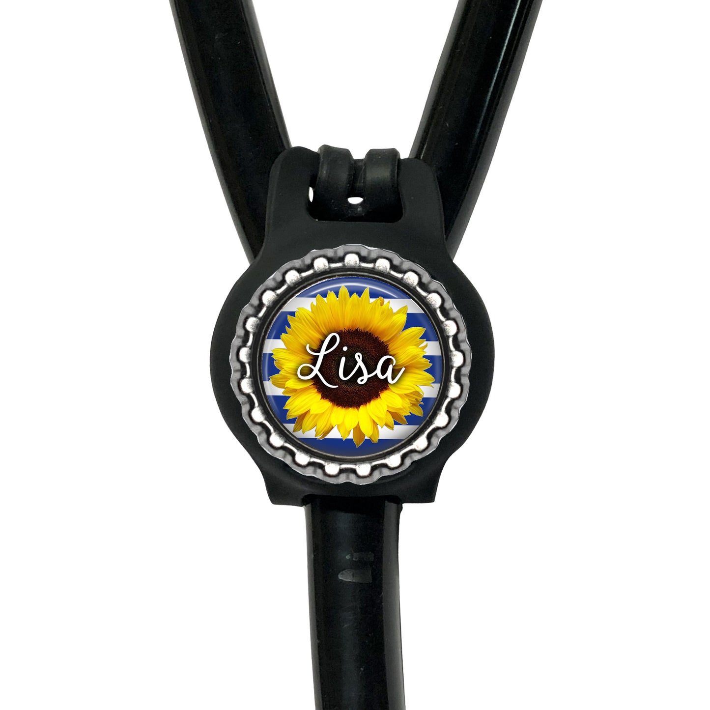 A black stethoscope with a personalized name badge attached to it.