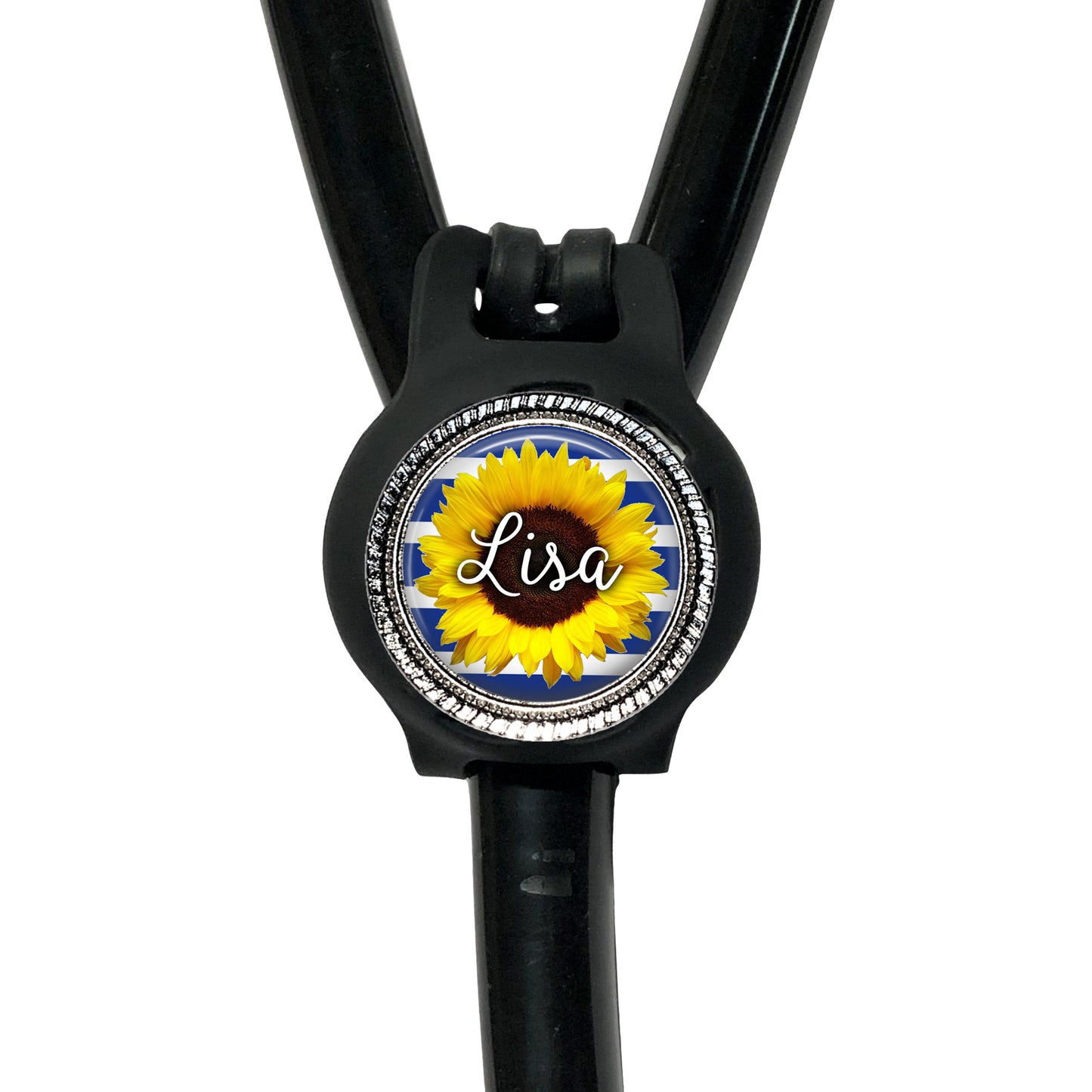 A black stethoscope with a personalized name badge attached to it.