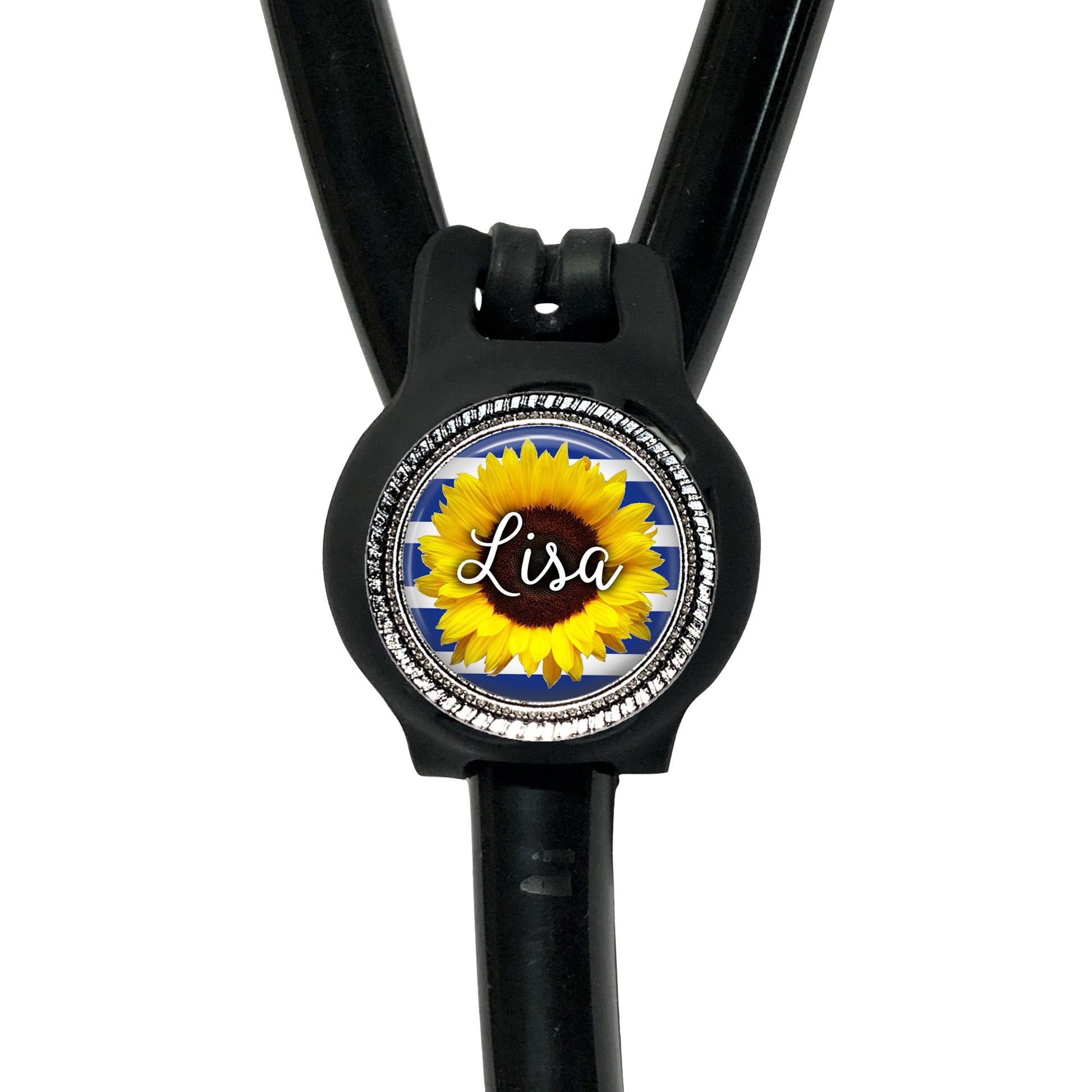A black stethoscope with a personalized name badge attached to it.