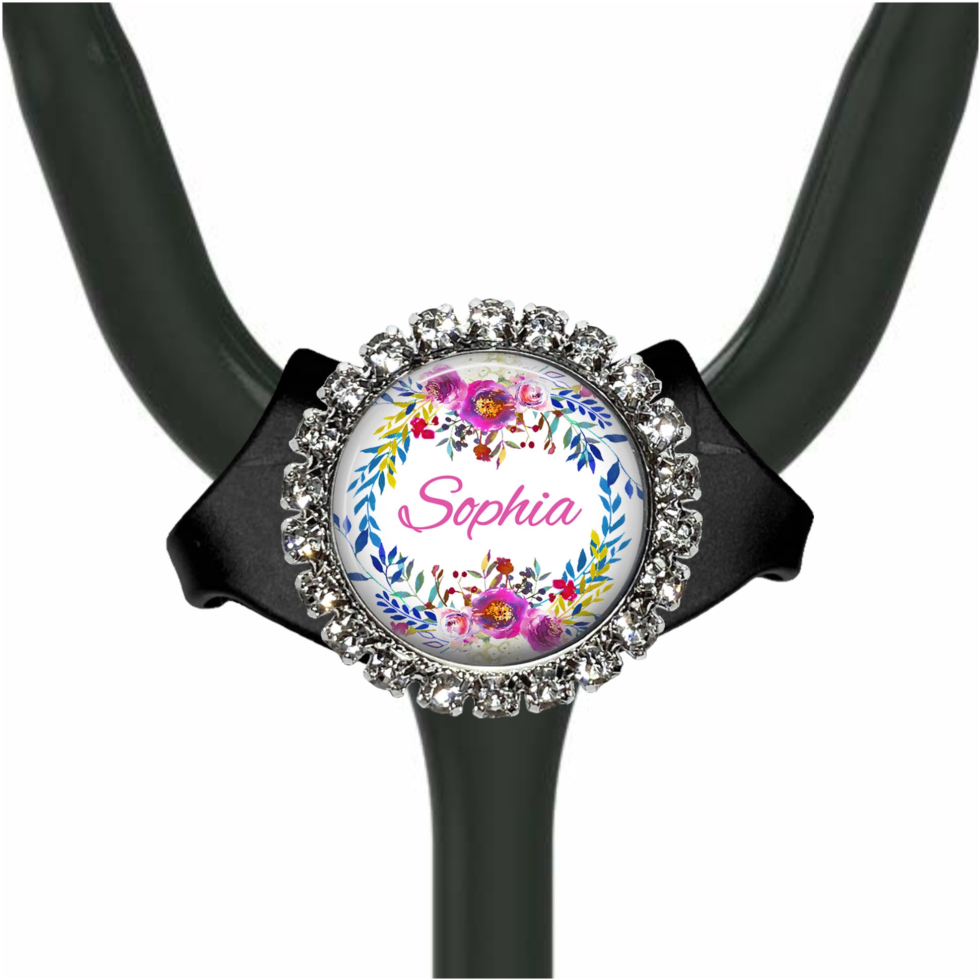 A personalized nameplate with a floral design, attached to a stethoscope.